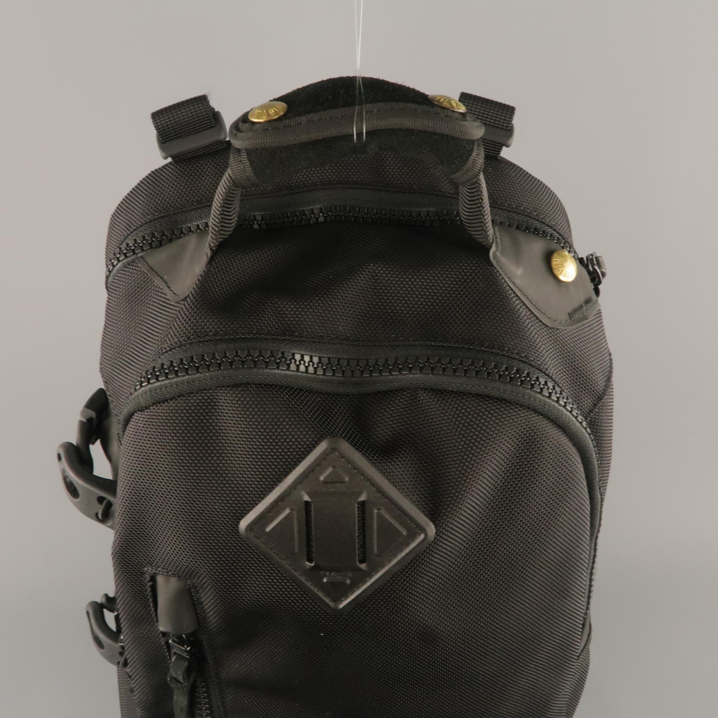 VISVIM Ballistic 20 Liter backpack comes in nylon textured canvas with a distressed suede bottom, multiple zip compartments, padded back, and adjustable straps. With tags.
 
Excellent Pre-Owned Condition.
 
Measurements:
 
Length: 12.5 in.
Width: 9