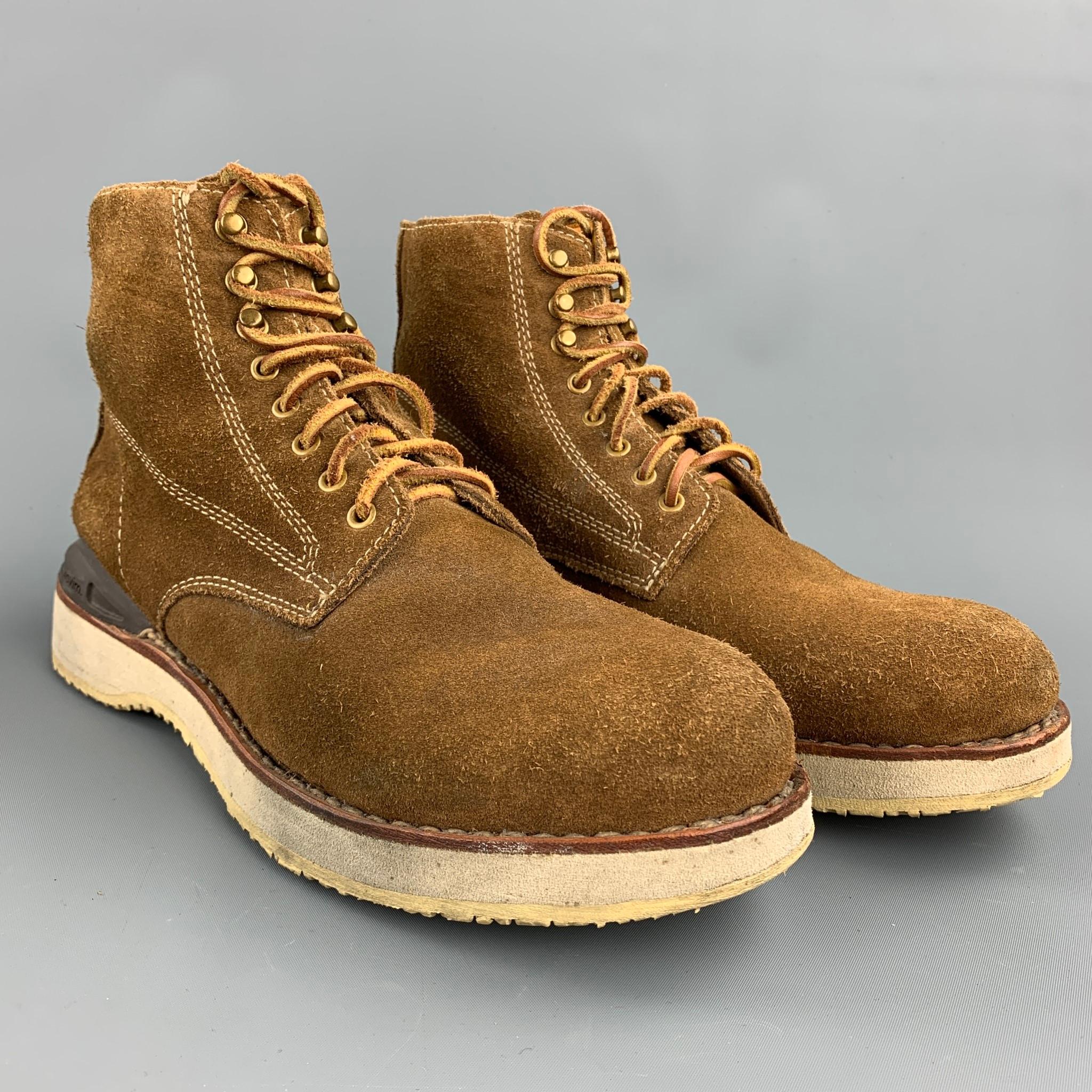 VISVIM boots comes in a brown textured suede featuring a worker style, contrast stitching, crepe sole, and a lace up closure. Minor wear. As-Is.

Good Pre-Owned Condition.
Marked: US 10

Width: 4 in. 
Length: 11.5 in. 
Height: 6.5 in. 