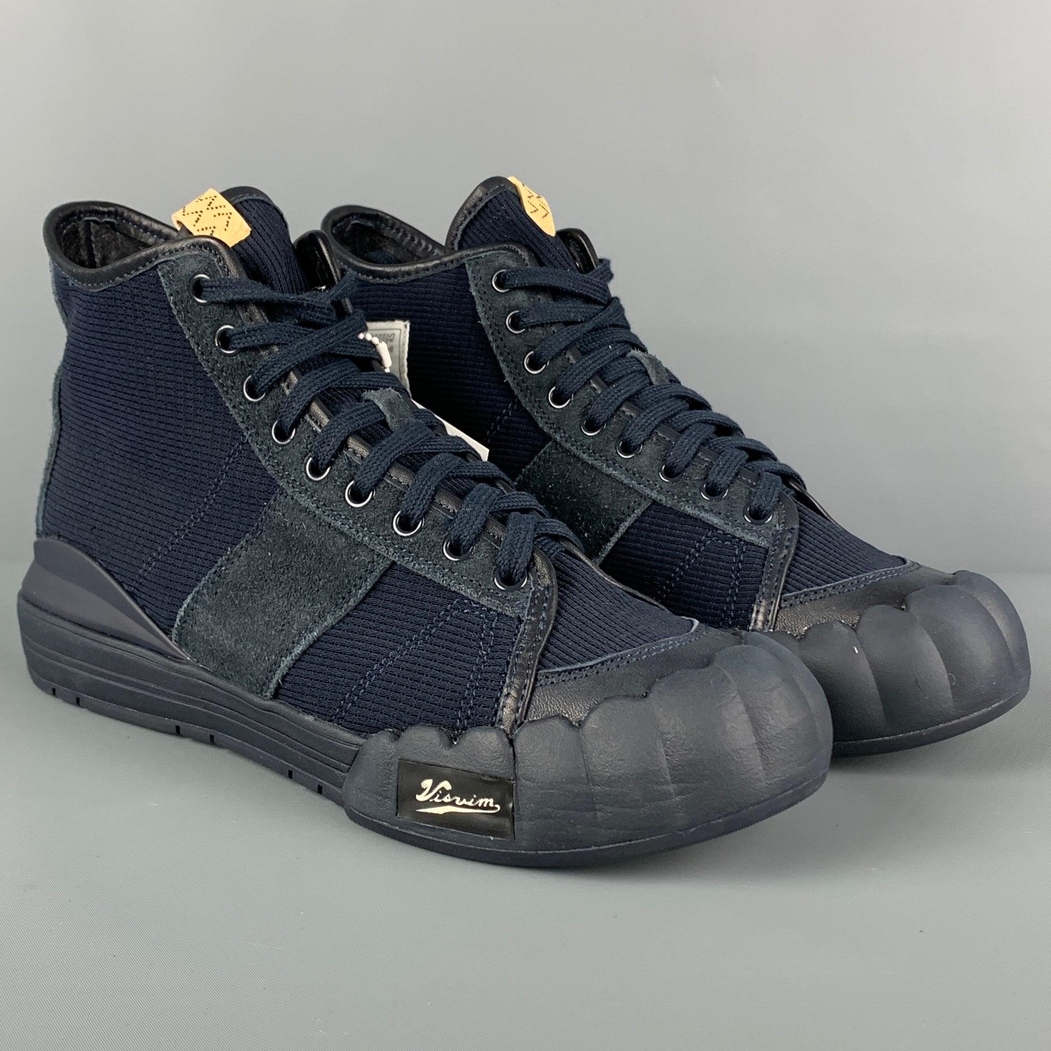VISVIM 'Lanier' sneakers comes in a navy paneled rib knit with a leather and suede trim throughout featuring a high-top style, rubberized to and heel, leather lining, and a lace up closure.
New With Box.
 

Marked:   10.5Outsole: 12 inches  x 4