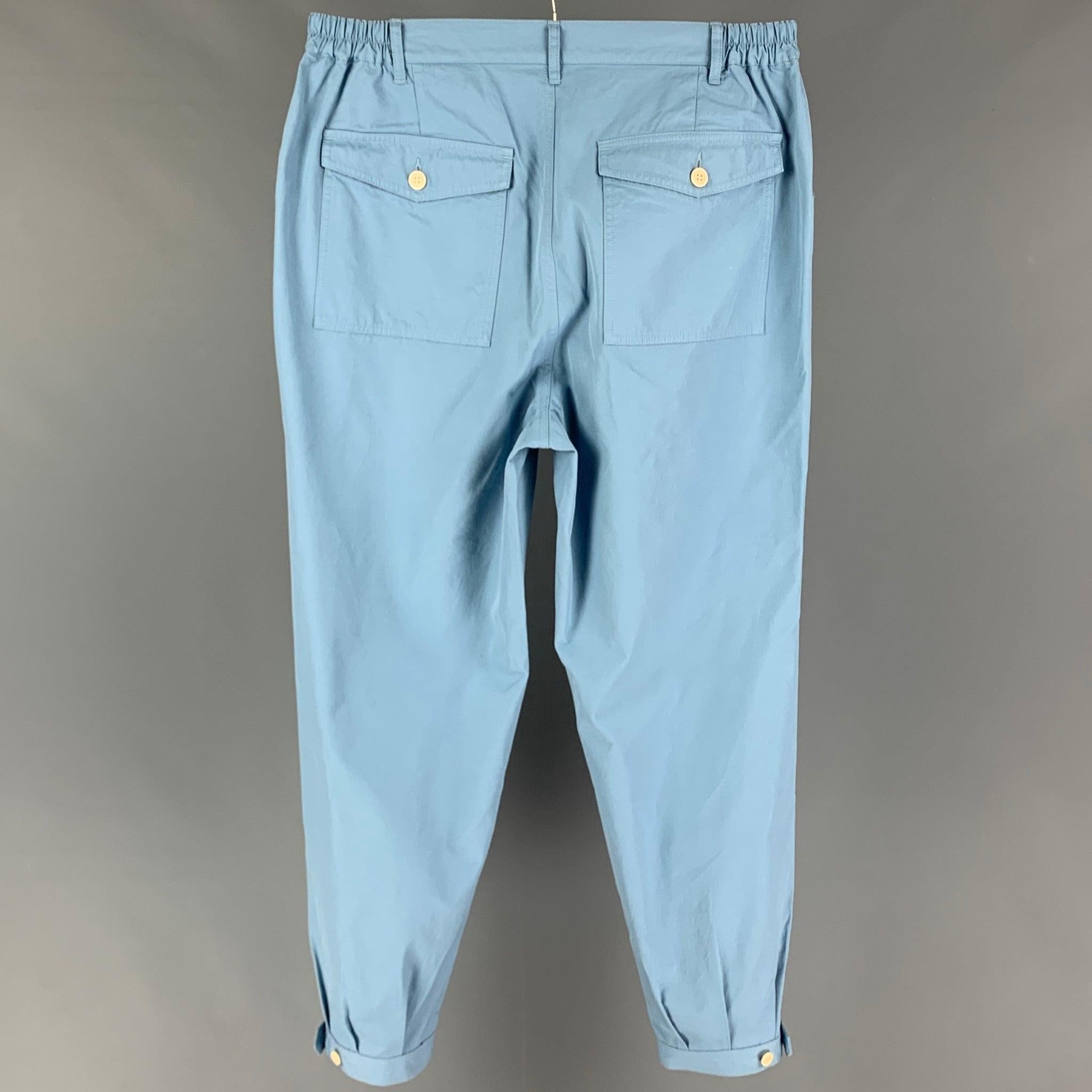 VISVIM 'Carroll' pants comes in a light blue cotton featuring a elastic waistband, buttoned cuffs, adjustable buttoned tab, and a zip fly closure. Made in Japan.
New With Tags.
 

Marked:   JP 3 

Measurements: 
  Waist: 34 inches  Rise: 14 inches 