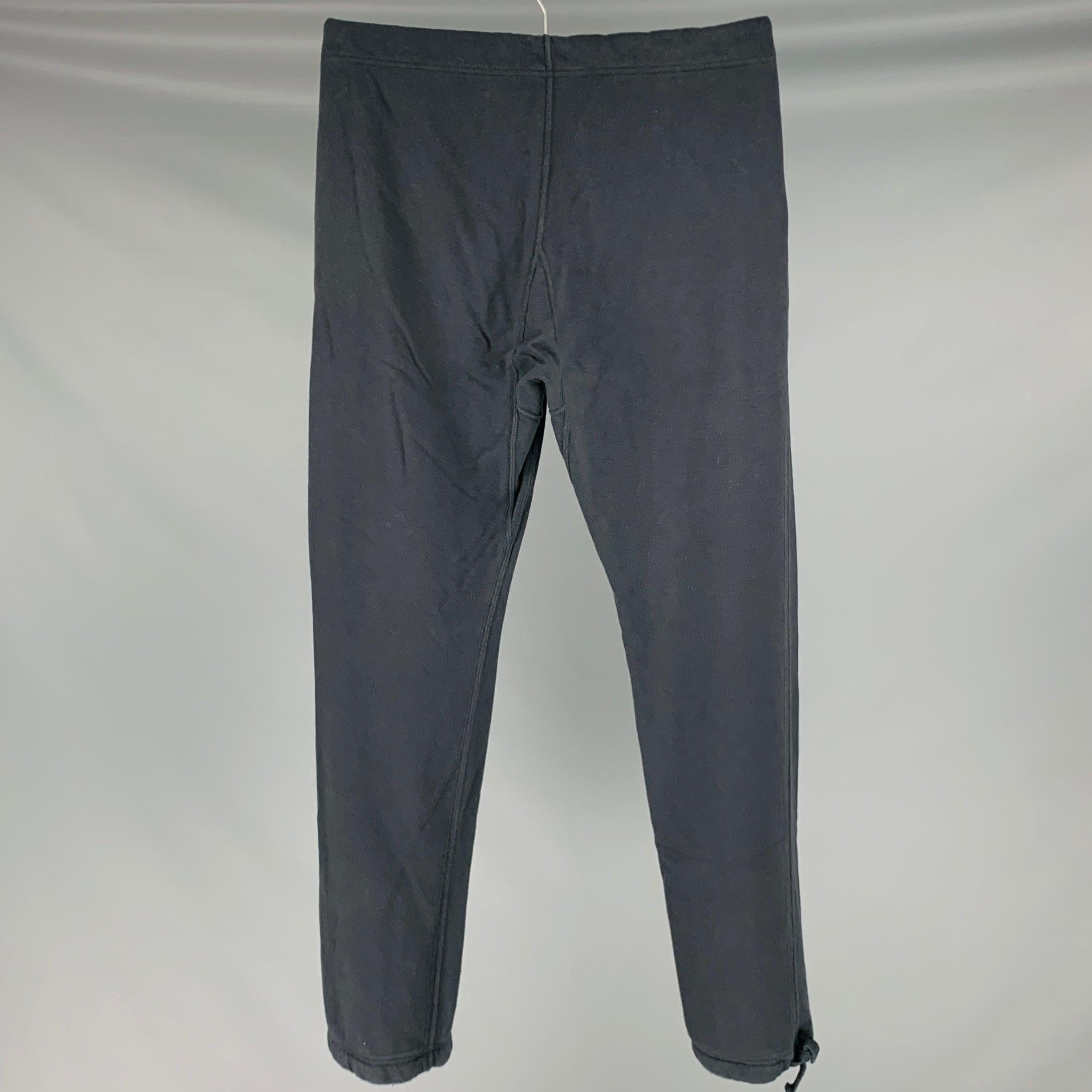 VISIM casual pants
in a
black cotton cashmere blend knit featuring a sweatpants style, and drawstring cuffs and closure. Made in Japan.New With Tags. 

Marked:   JP 2 

Measurements: 
  Waist: 44 inches Rise: 10 inches Inseam: 32 inches Leg Opening: