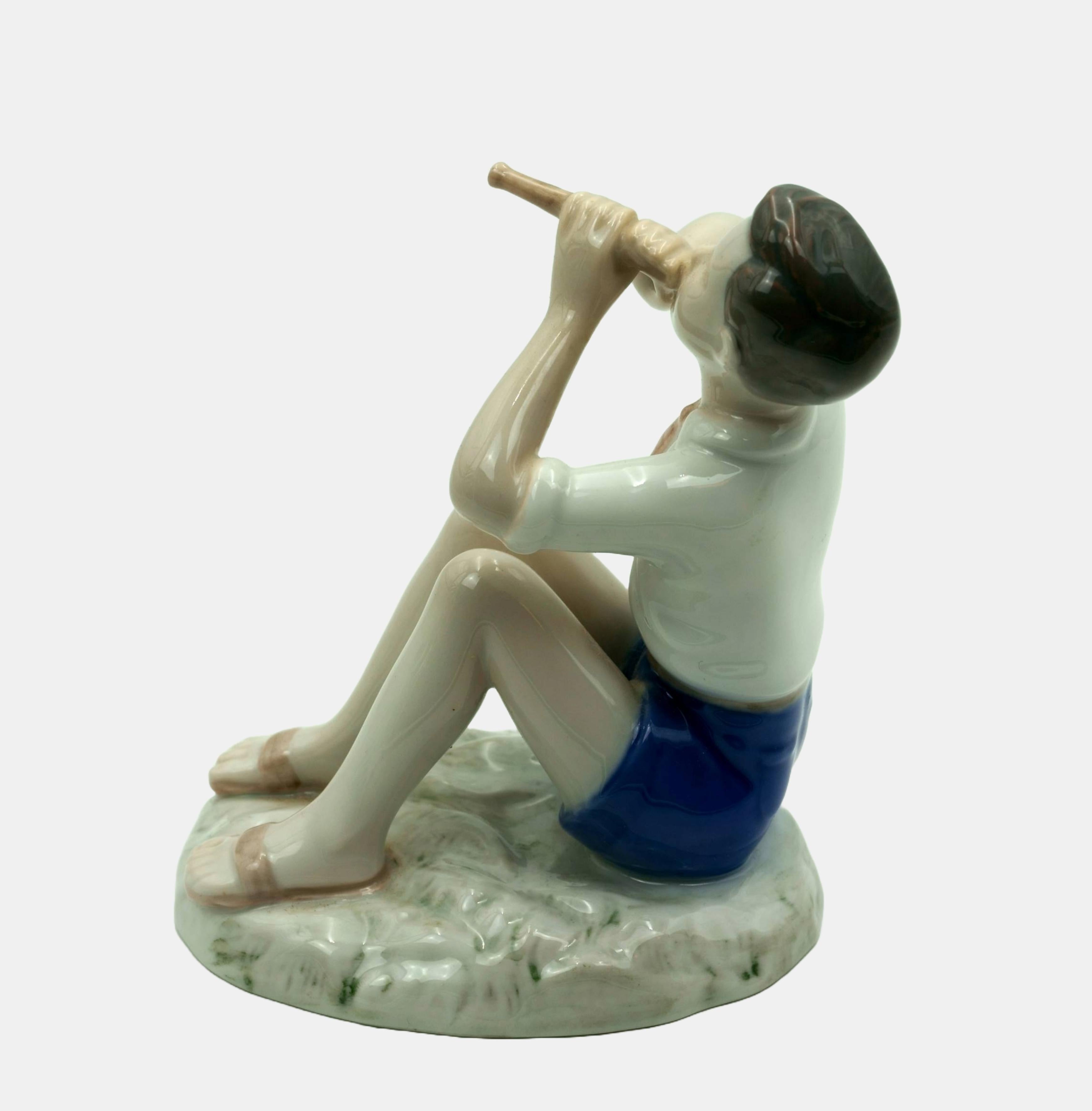 Bing & Grondahl Figure Boy playing the flute / - The lightness of tones - - Gray Figurative Sculpture by Vita Birgitte Thymann