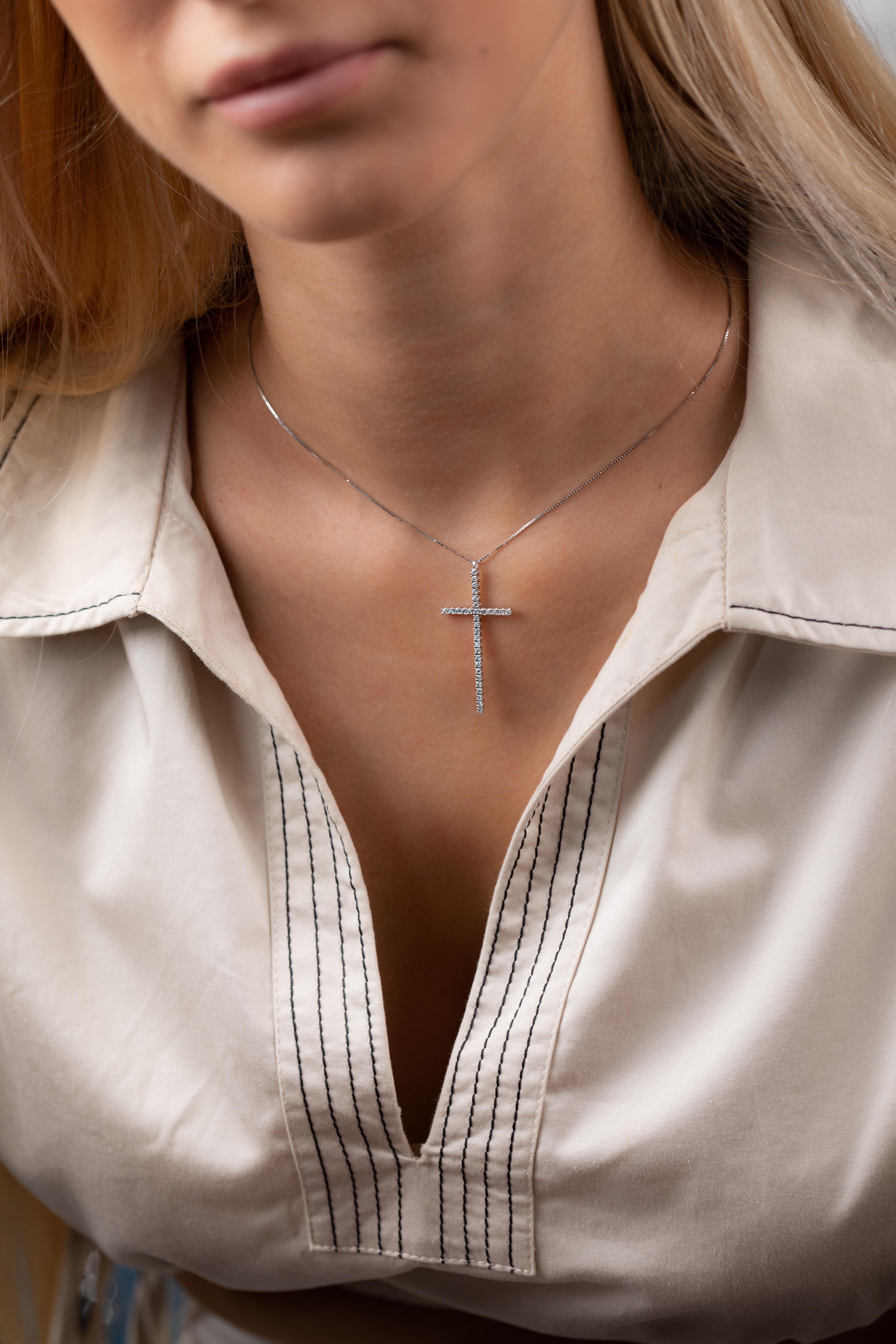18K white gold flexible cross pendant is from Timeless Collection. This piece of jewellery is made of natural white diamonds in total of 0.48 Carat. Total metal weight is 3.10 gr. The pendant is 4cm long.  The white gold chain is 40 cm long. Perfect