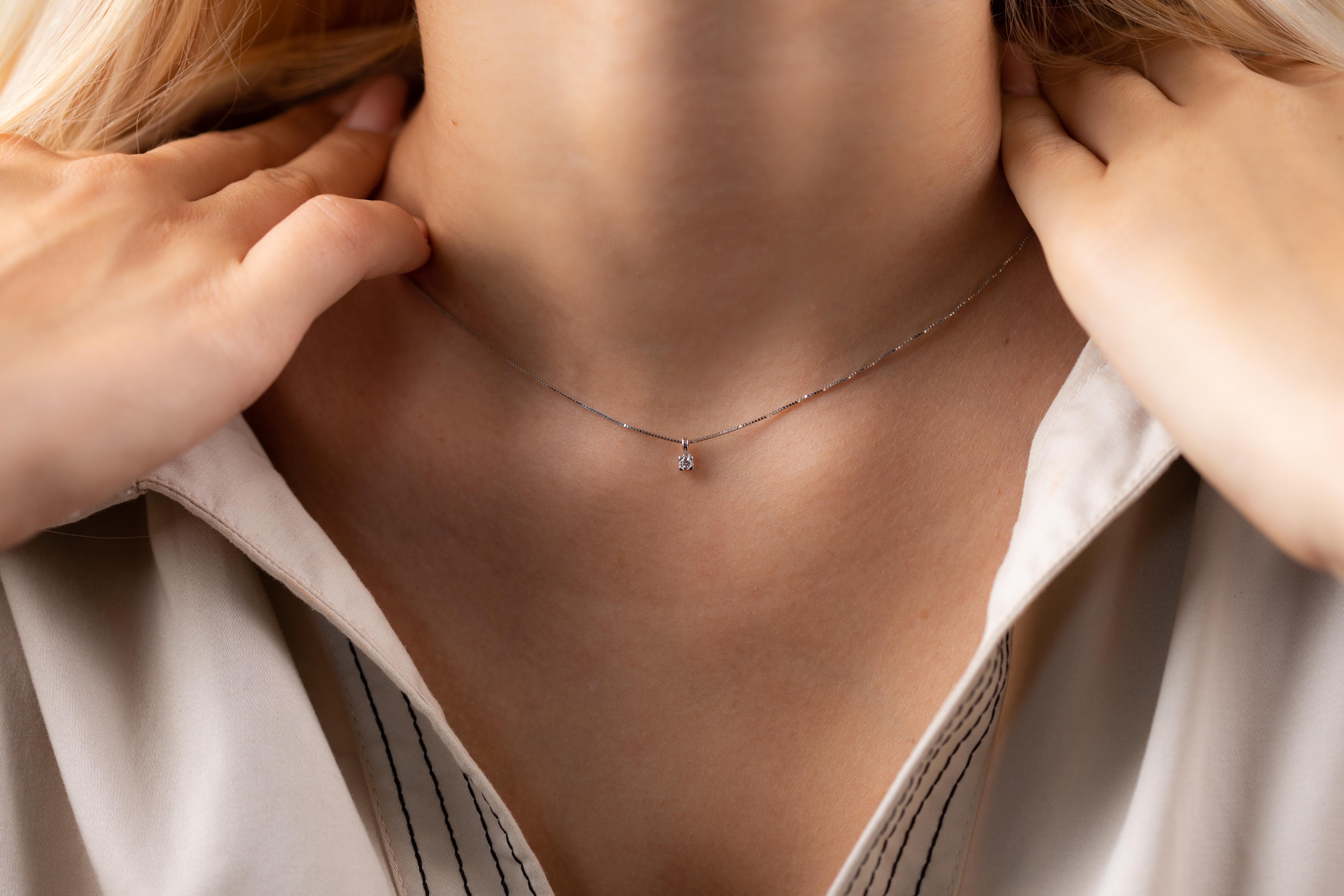 18K white gold delicate  solitaire pendant is from Timeless Collection. This piece of jewellery is made of a natural white diamond 0.06 Carat. Total metal weight is 2.1 gr. The white gold chain is 40cm long. Perfect for any occasion! 

The Timeless