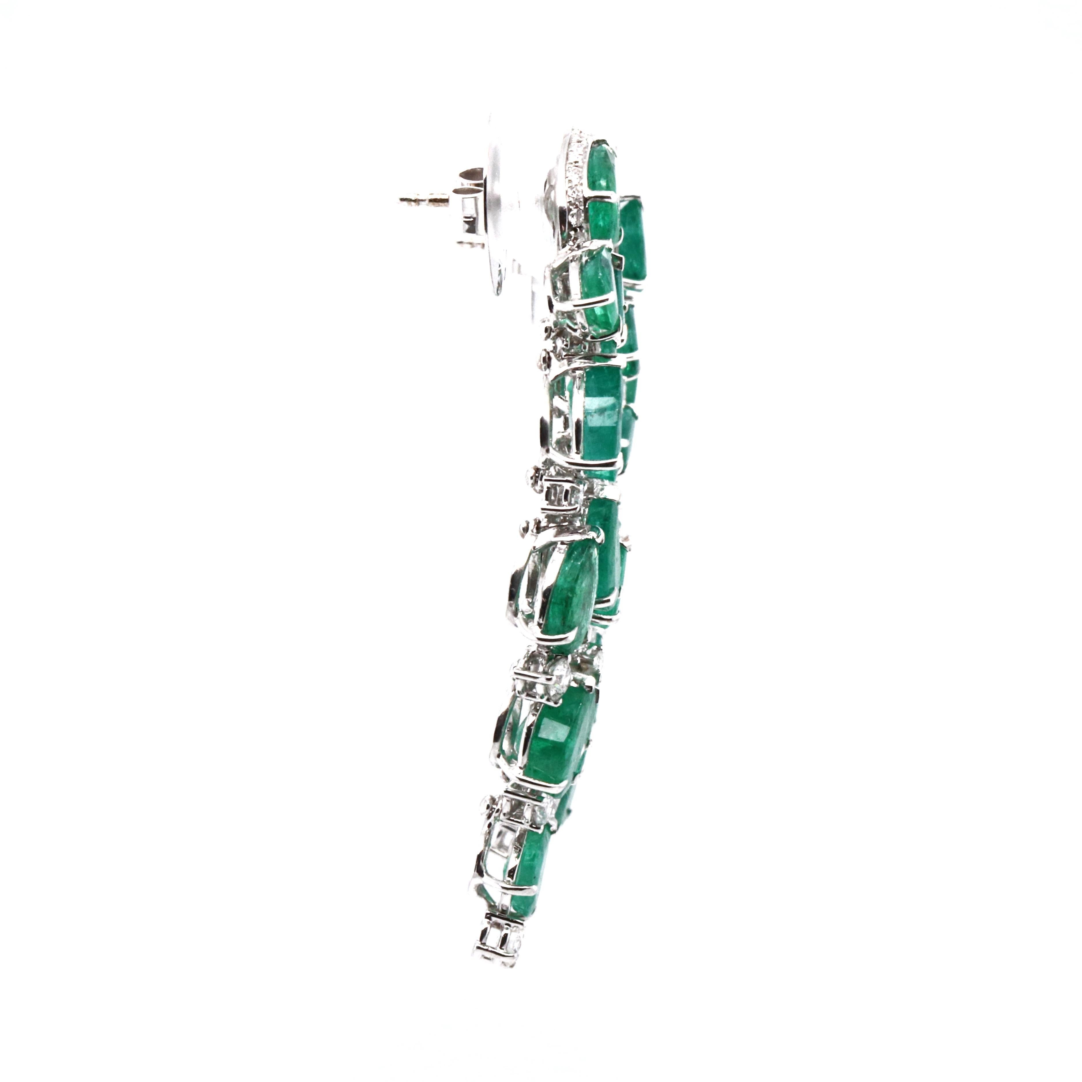 These 18K white gold stunning chandelier earrings are from our Divine collection. These chandelier earrings are created from natural white diamonds 2.52 Carat and beautiful pear shape natural emeralds in total of 17.13 Carat. They are 5 cm long.