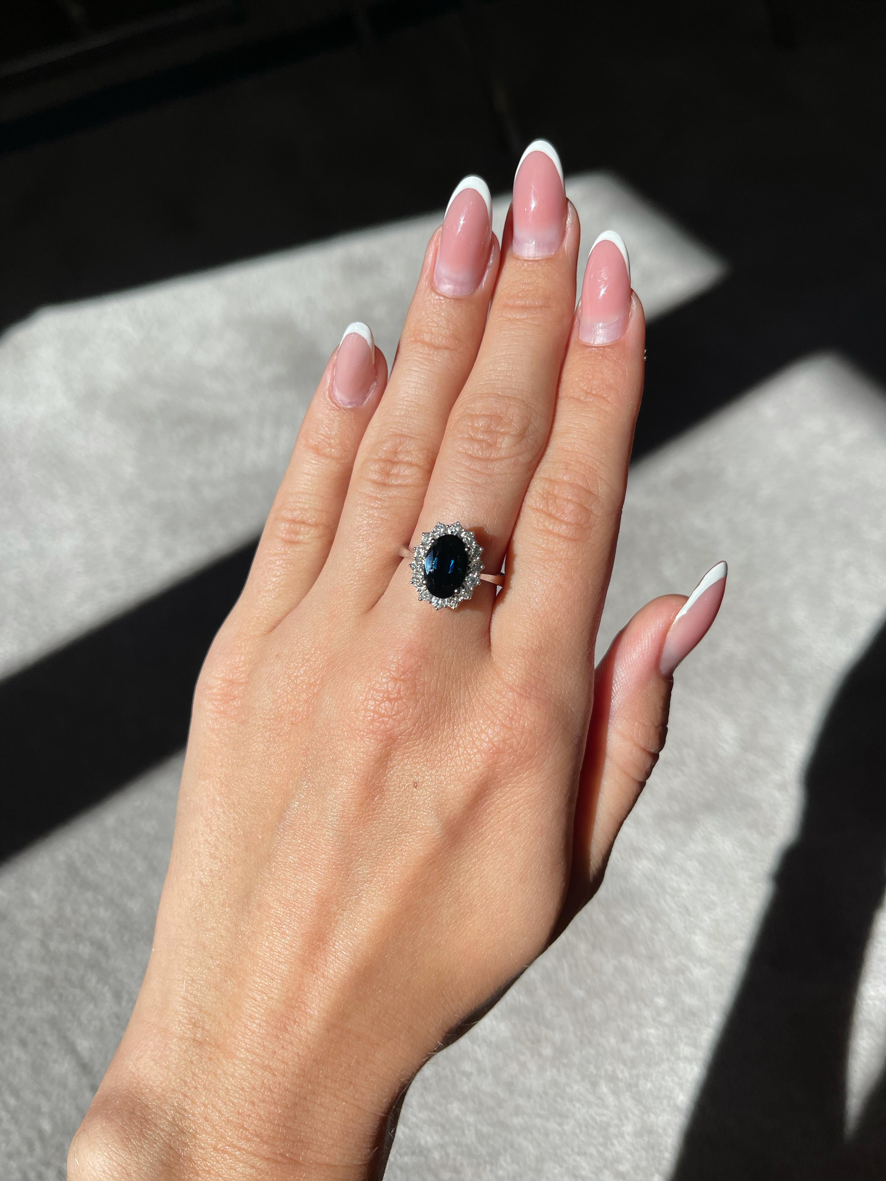 This 18K white gold elegant ring is from our Timeless Collection. It is made of a beautiful blue oval shape sapphire 2.76 Carat decorated by 14 round shape natural white diamonds in total of 0.50 Carat. Total metal weight is 5.5 gr. Perfect piece