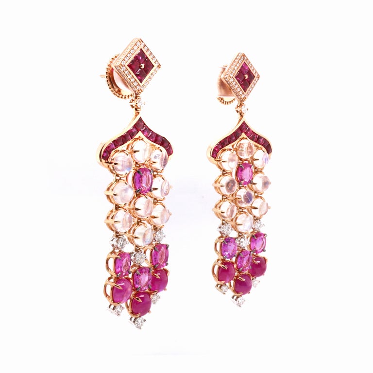 These 18K yellow stylish chandelier earrings are from our Divine collection. These chandelier earrings are created from natural white diamonds 1.15 Carat, natural cabochon shape rubies in total of 6.45 Carat, other rubies in total of 3.21ct, natural