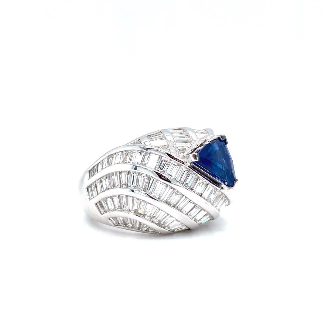 18K white gold cocktail ring is from our Ocean Treasures Collection. This piece of jewellery is a precise combination of white baguette diamonds in total of 5.2 Carat and trillion shape natural blue sapphire 2.01 Carat. Total metal weight is 21.70