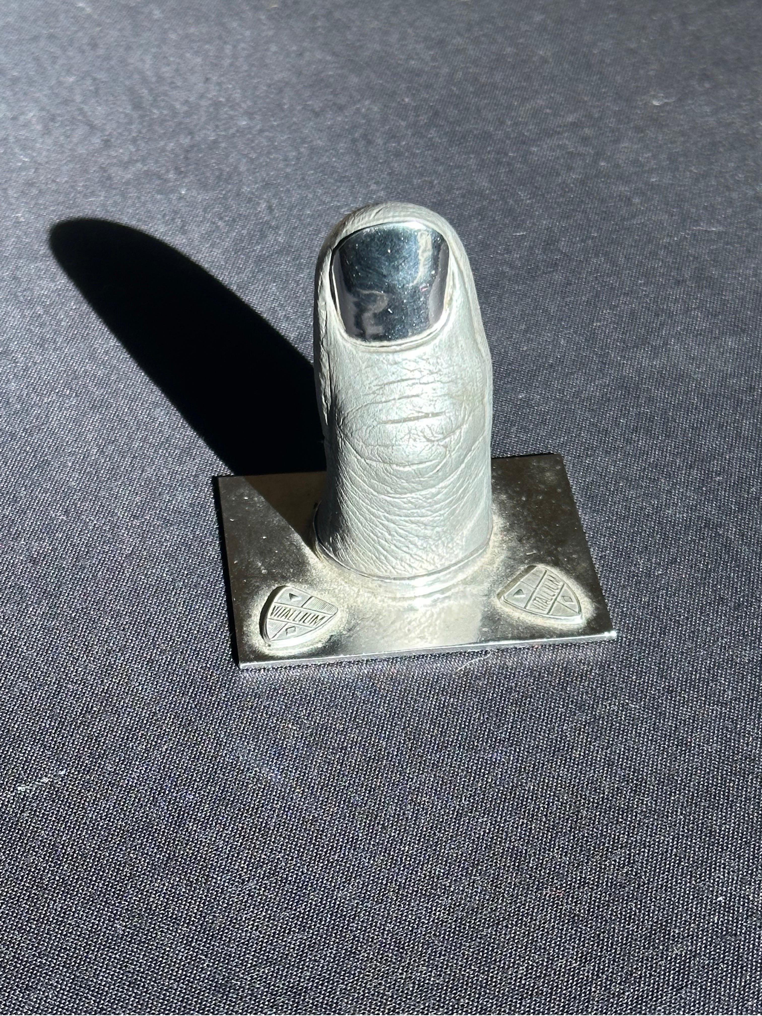 No other example of this sculpture has been found, a promotional product for the medical-grade carbon alloy used for surgical prosthetists. 

Slightly larger than life scale, clever chrome nail, and extremely detail in texture/finger print.