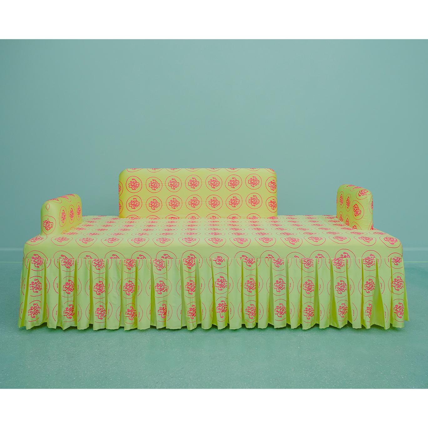 “Vitamin D” sofa is inspired by the artistic form of classical Chinese furniture such as those in temples and imperial courts. It is completely covered in fine silk, hand-embroidered with the molecular geometry of Vitamin D, the vitamin related to