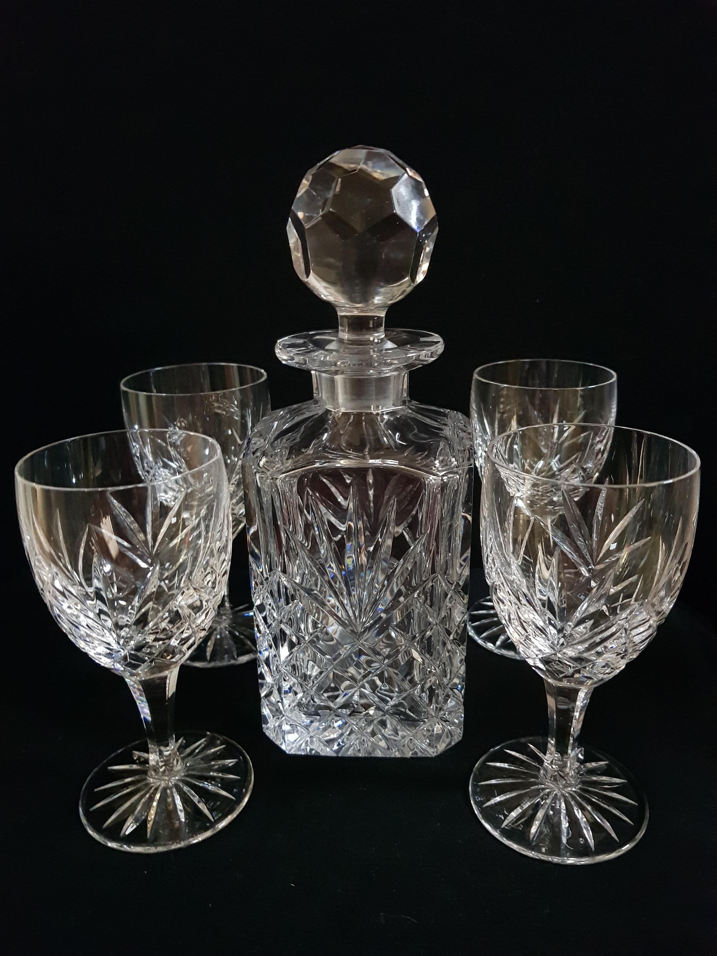 Beautiful vitange Bohemian brilliant cut crystal drinking set, decanter and stopper and 4 glasses brilliant condition.