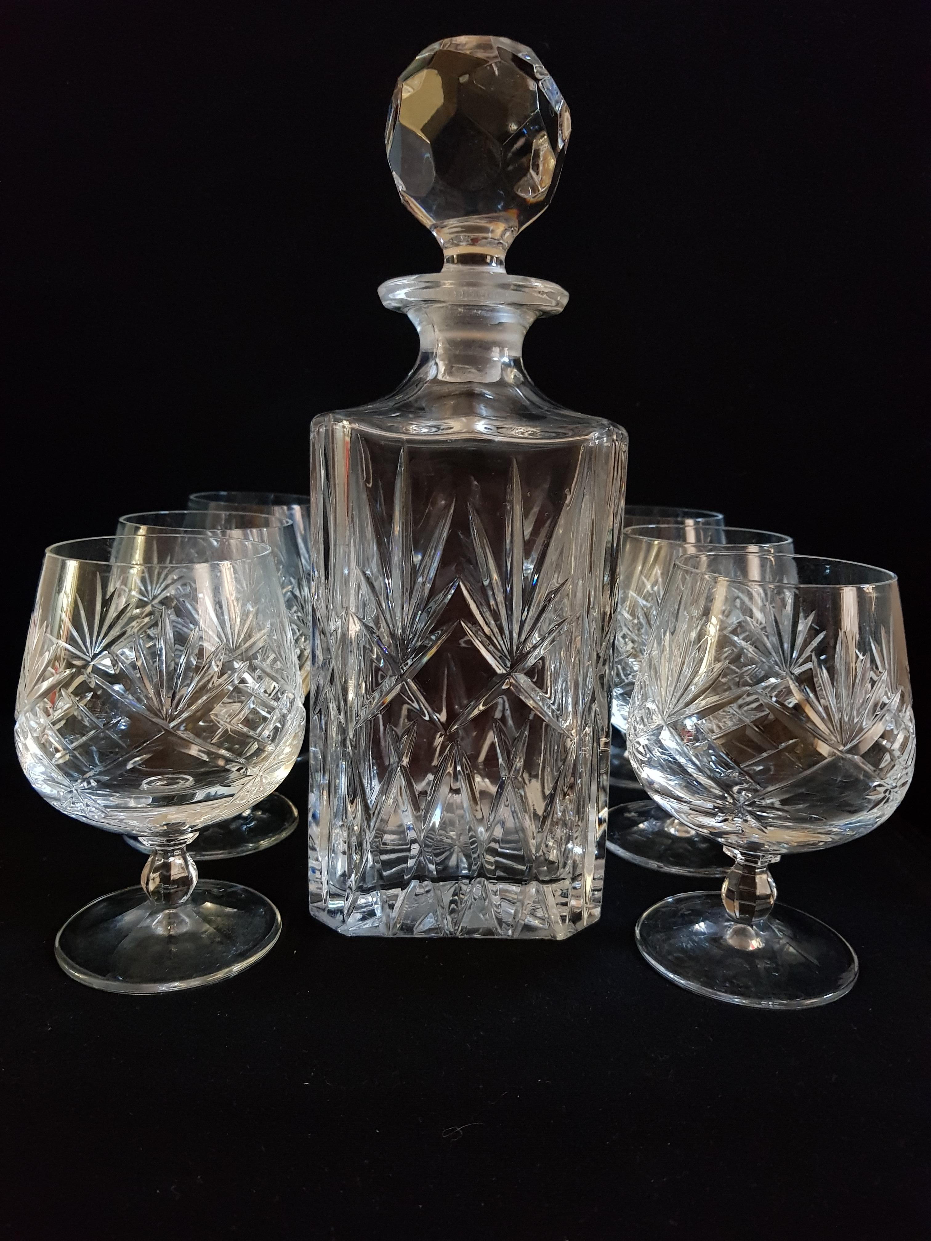 Beautiful vitange Bohemian crystal cut drinking set, decanter and stopper with 6 glasses brilliant condition.