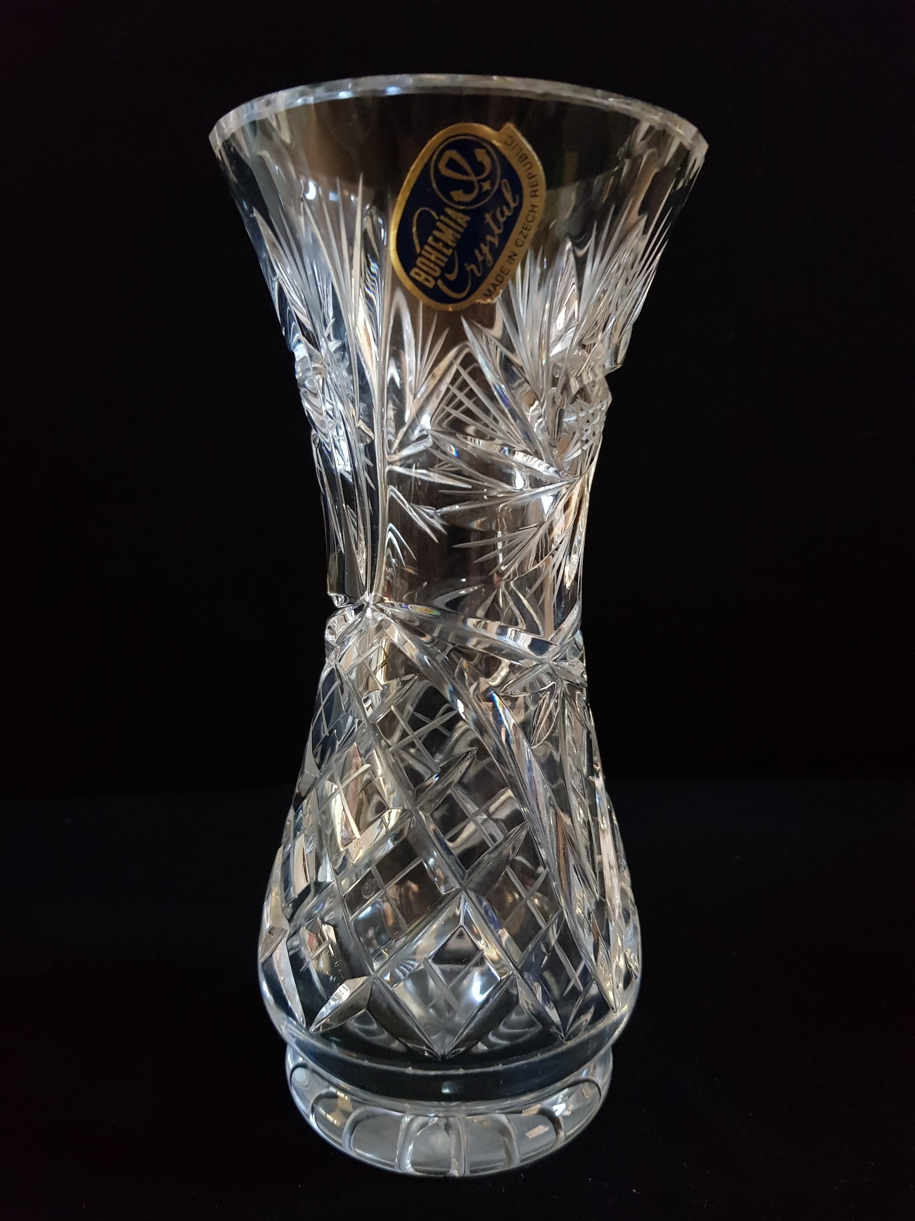 Beautiful set of 3 Bohemian hand cut crystal vases, brilliant cut, brilliant condition. Dimensions it's 18, 17, 16 cm tall.