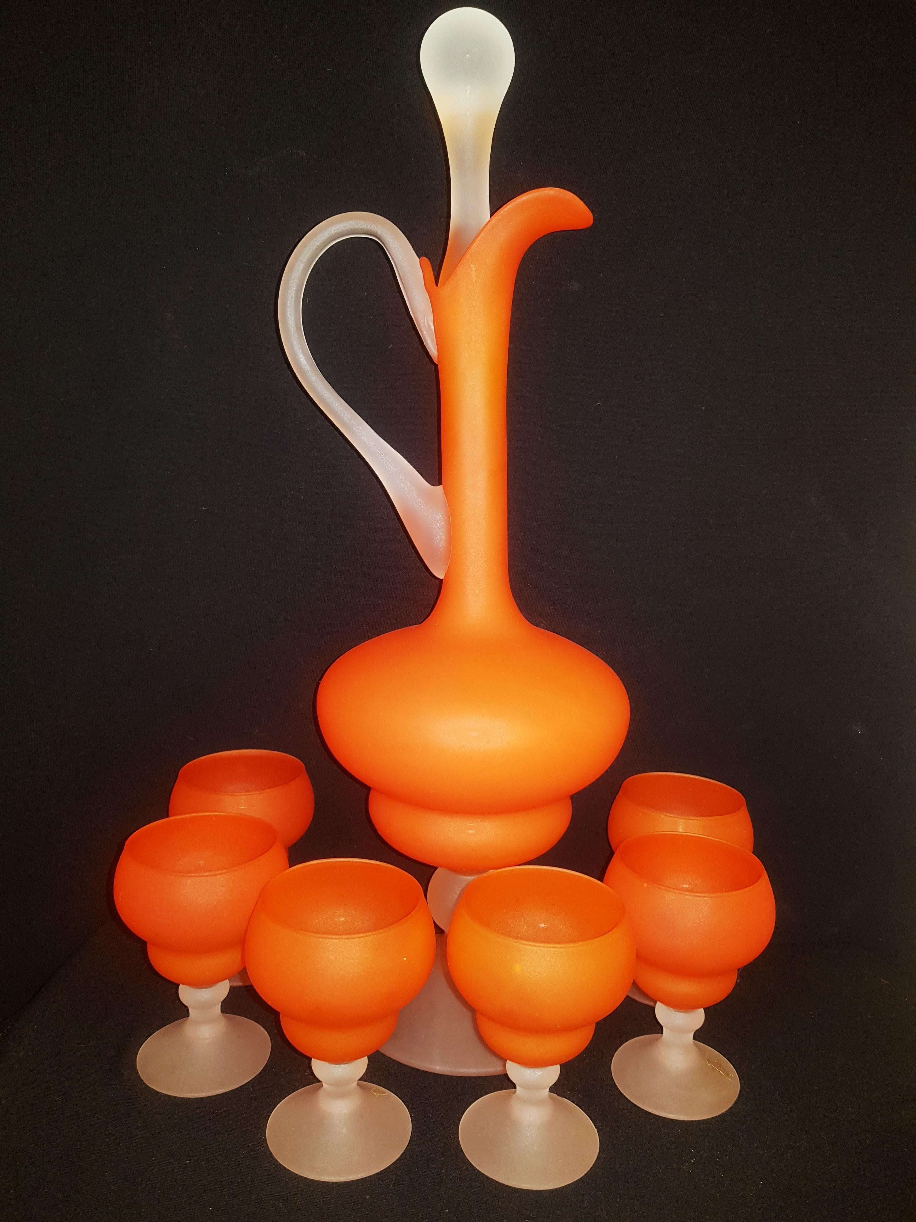 Beautiful Empoli Satinato glassware in orange and white. The decanter with the stopper is 42cm tall and the six glasses are approximately 10cm tall. In excellent condition.