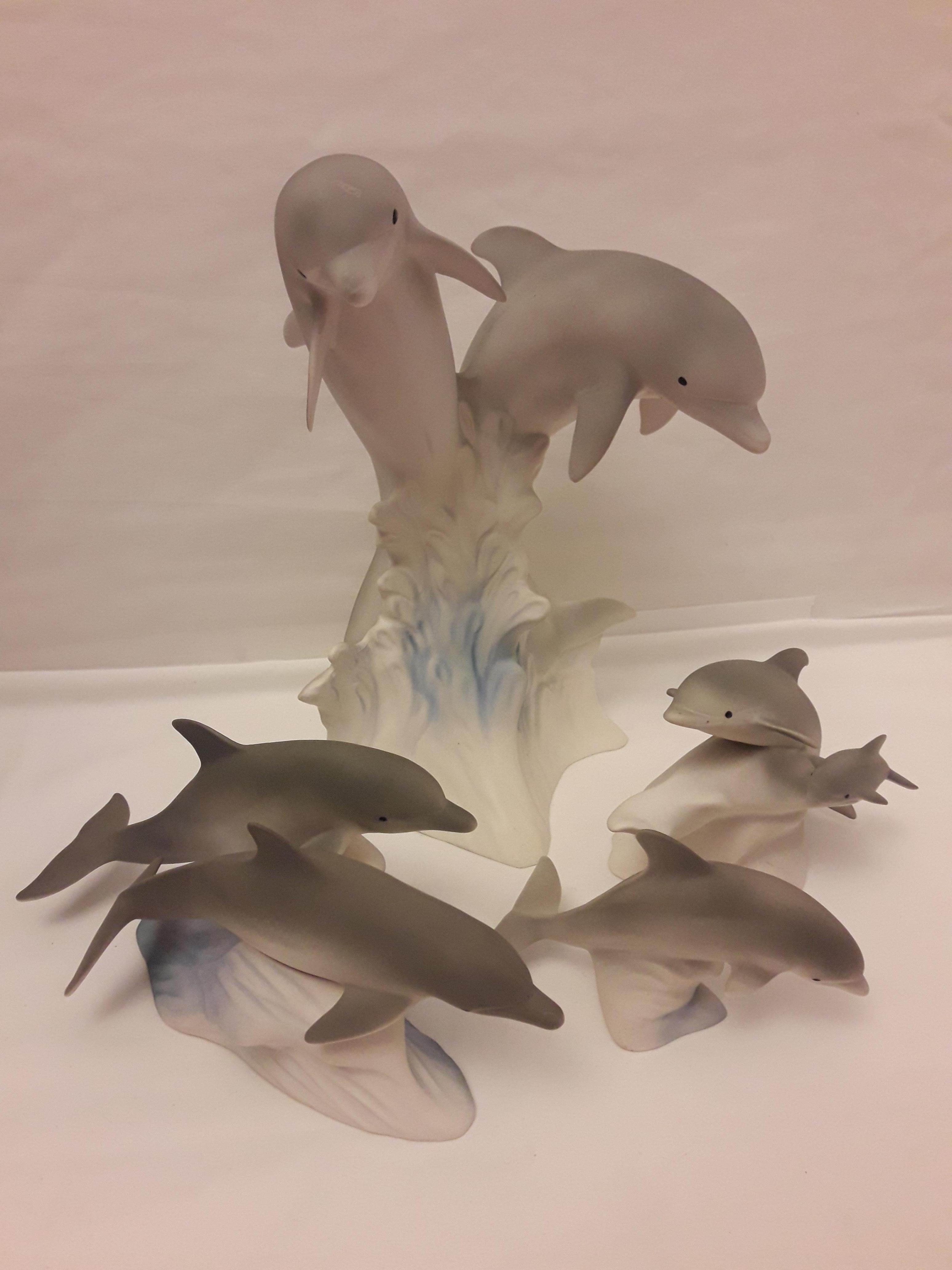 Beautiful vitange Highbank porcelain dolphines sculpture set of 4 brilliant condition.