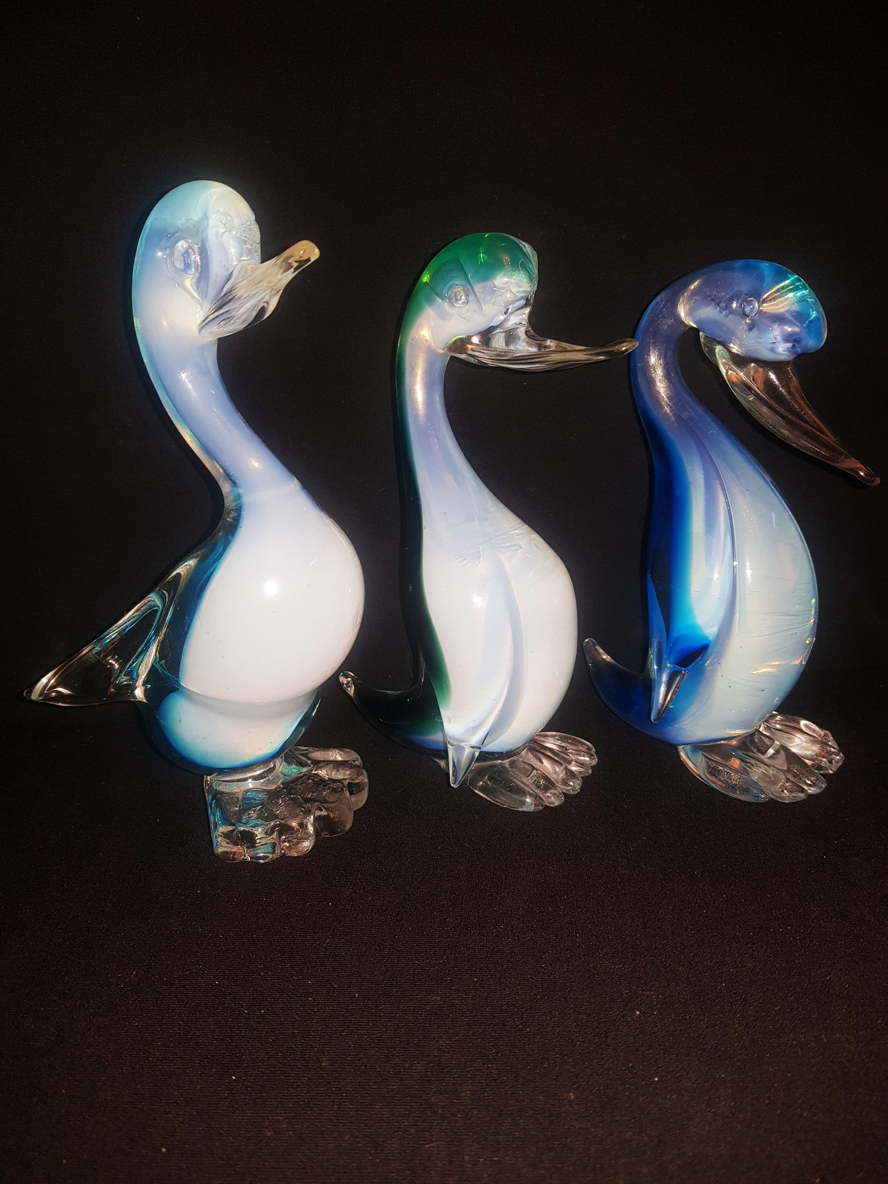 Set of three Murano glass sommerso opaline birds in blue, white and green, attributed to Fratelli Toso; years 1960-1969. The birds are 16cm, 17cm, and 18cm tall, respectively. In excellent condition. 