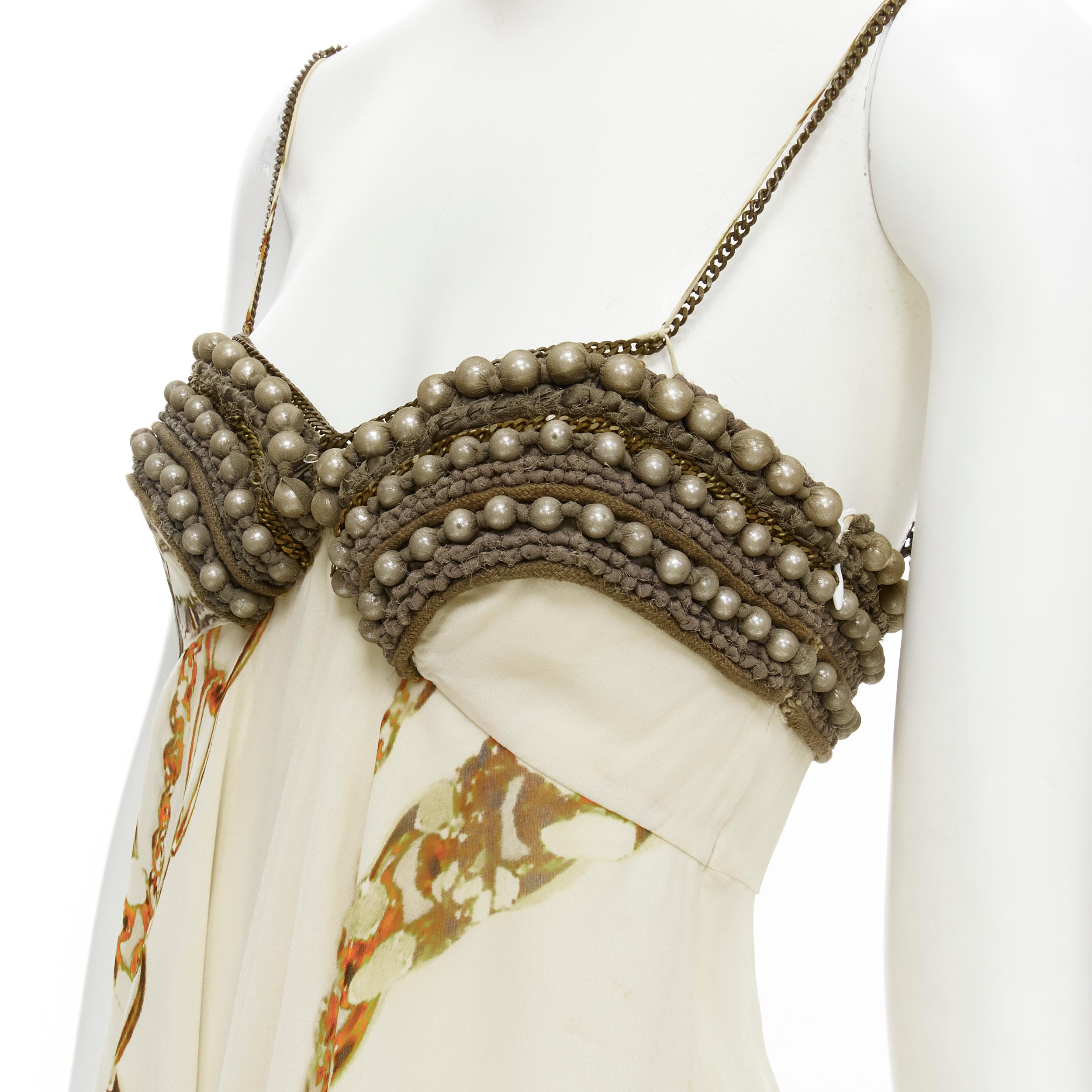 vitnage STELLA MCCARTNEY 2005 pearl bust gold chain print silk dress IT40 XS 
Reference: CELG/A00199 
Brand: Stella McCartney 
Designer: Stella McCartney 
Collection: 2005 
Material: Silk 
Color: Beige 
Pattern: Absrtact 
Closure: Zip 
Extra Detail:
