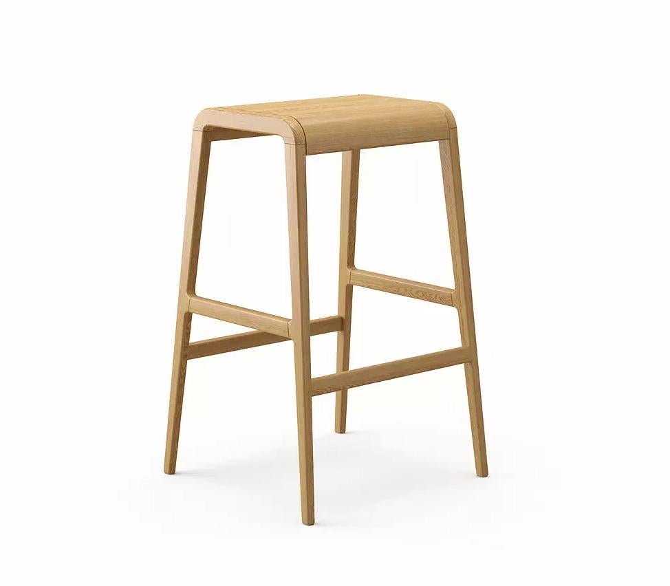 Vito bar stool by Dare Studio, 2012
Dimensions: H 70 x D 42.5 x W 45 cm
Materials: European white oak.

Also available in American black walnut, wax oiled finish. 

Dare Studio is a British design company producing award winning furniture for