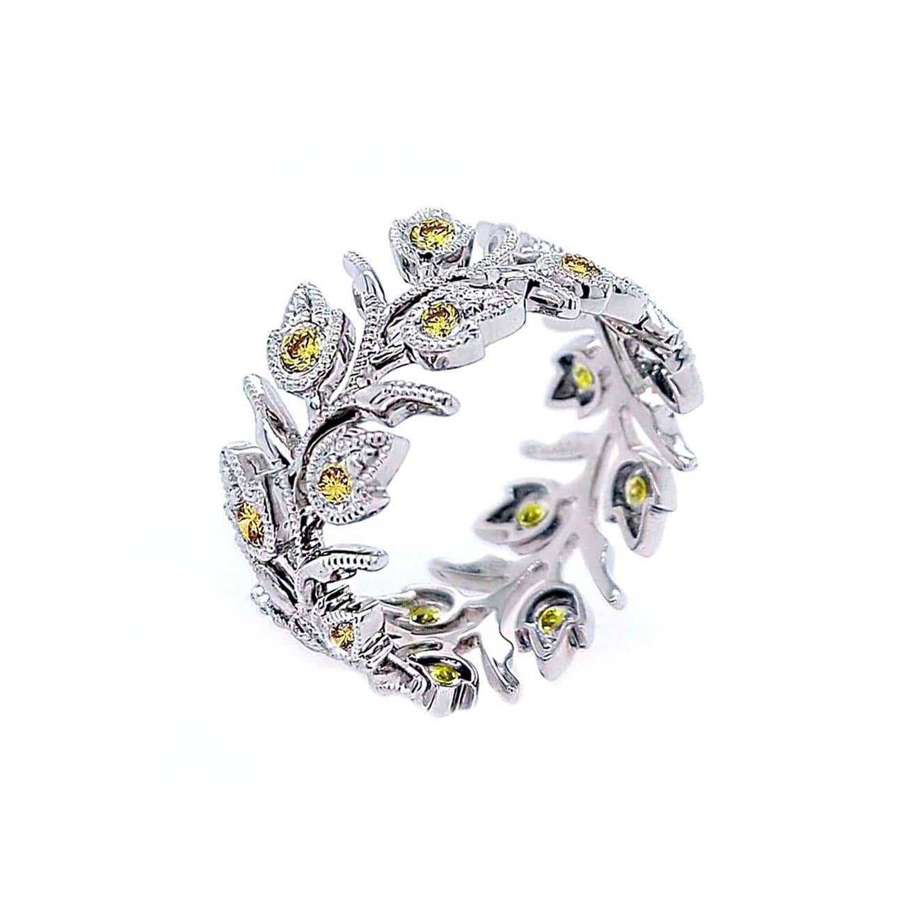 Produced by award winning Italian designer Stefano Vitolo. Stefano creates custom artisanal one of a kind jewelry with excellent gemstones in a truly old world Italian craftmanship.
This handcrafted ring has 0.82 total carat weight of Fancy Yellow