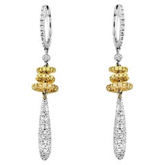 Boucles d'oreilles pendantes en or 18 carats avec diamants en forme de rondelles