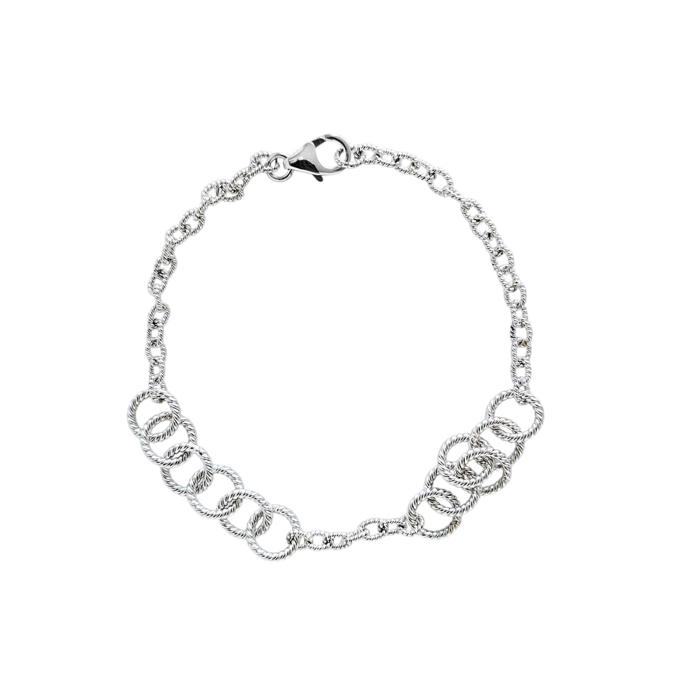 This handmade bracelet is crafted from solid 18K white gold with interlocking twisted rope circles. Elegant and beautifully made, it adds a timeless touch to any look. Perfect on its own or stacked with other favorites.