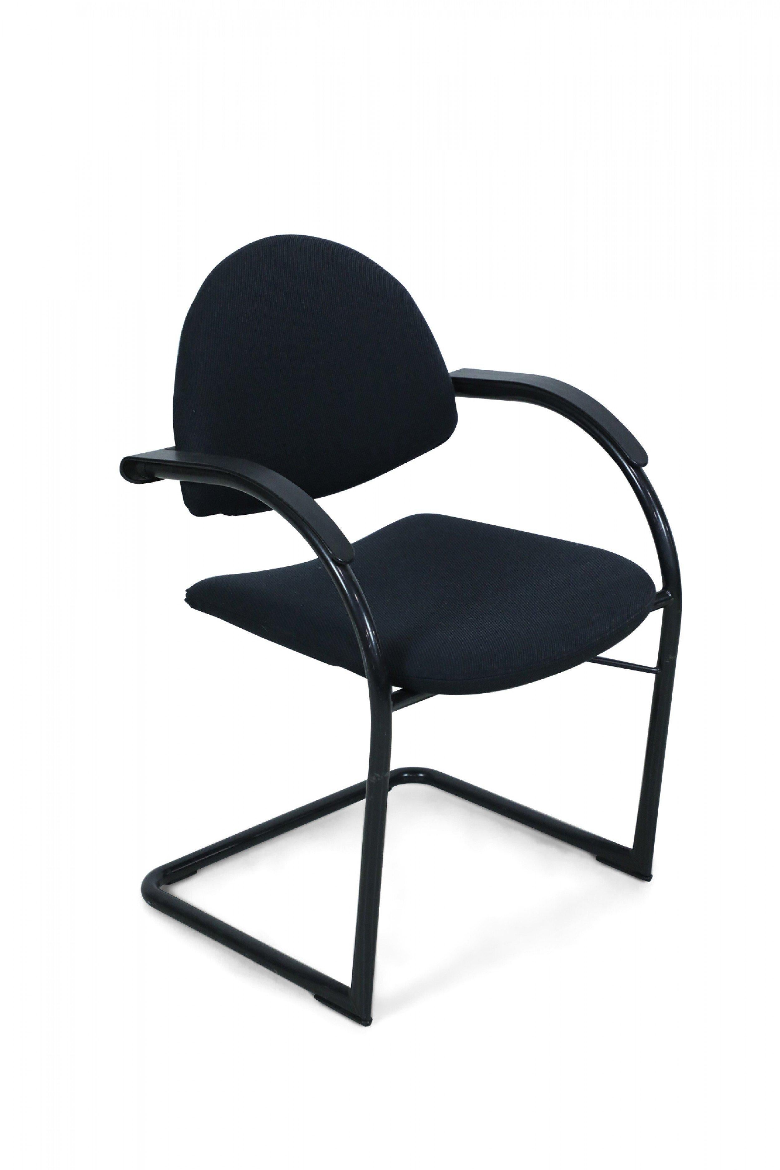 Contemporary black plastic and fabric upholstered office chair with adjustable back rest, curved arms, and stretcher base (VITRA for Mario Bellini).
      