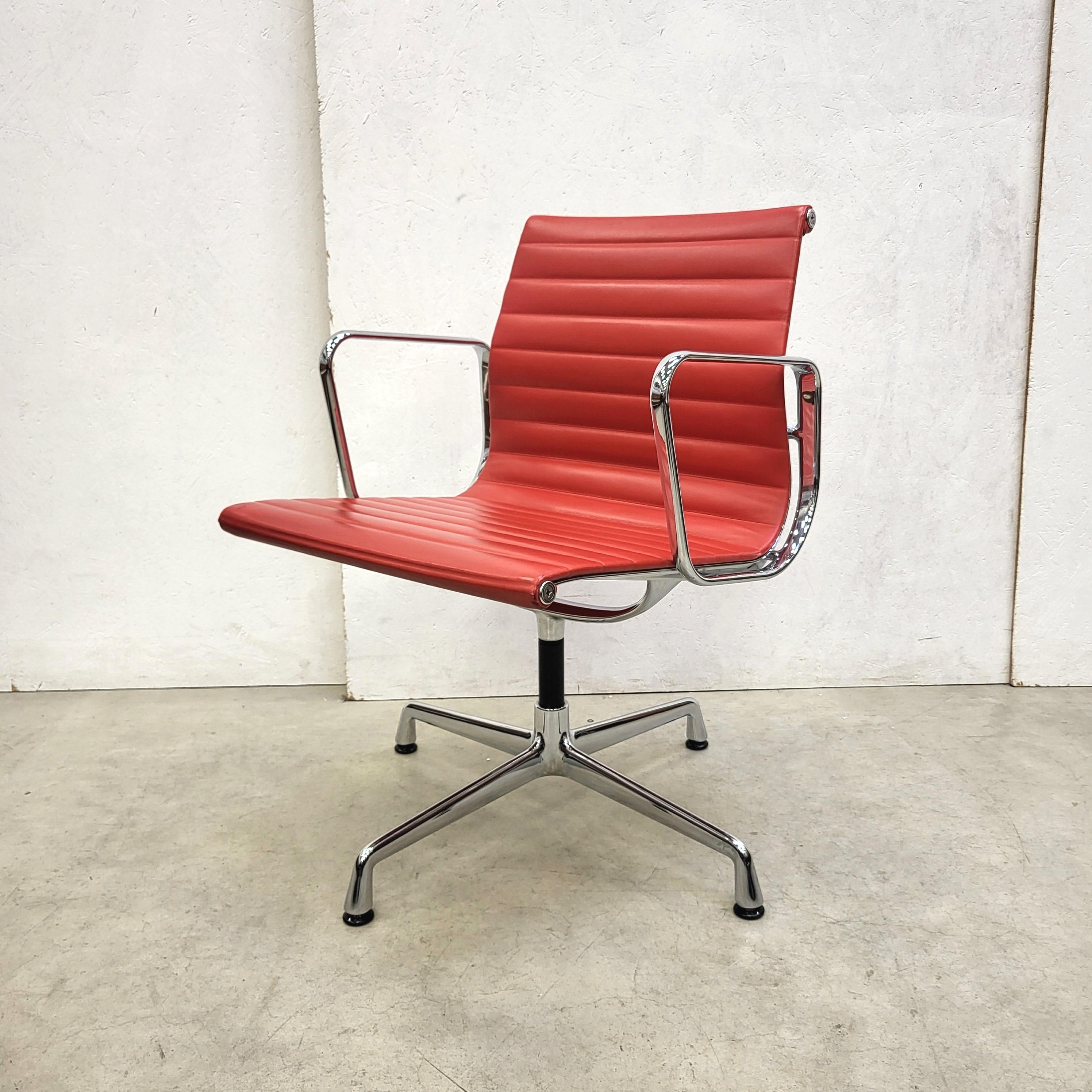 Rare set of 4 red leather chairs model EA108 produced by Vitra and designed by Charles Eames. 
The chairs features a chromed aluminium frame and are all made in 2013.

The set is perfect useable in a dining or conference room.

The chairs are in an