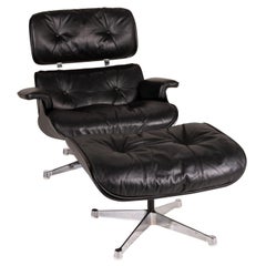 Vitra Eameas Lounge-Ledersessel, schwarz mit Ottomane