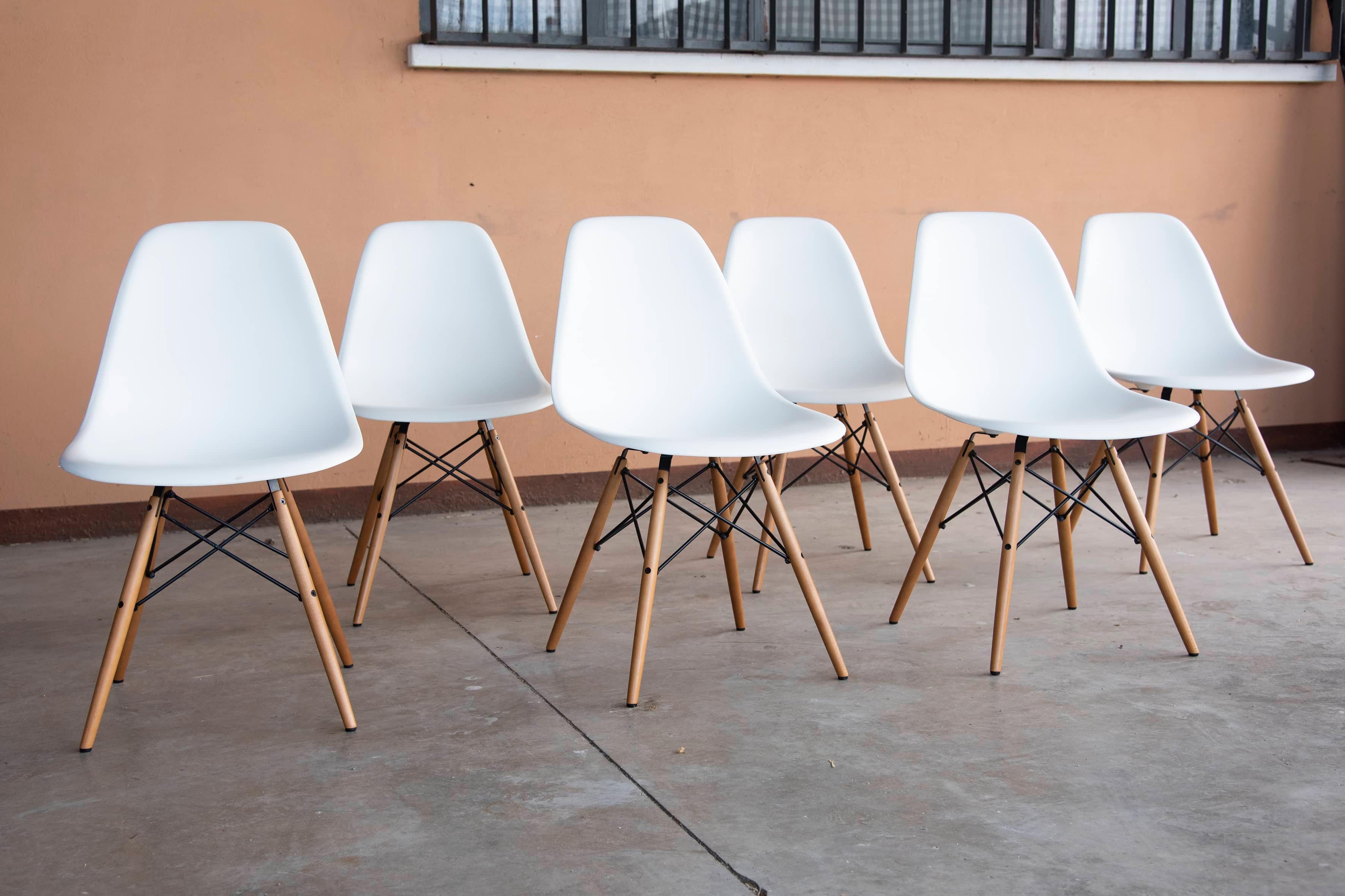 Contemporary Vitra Eames White Plastic and light Wood Side Chairs DSW