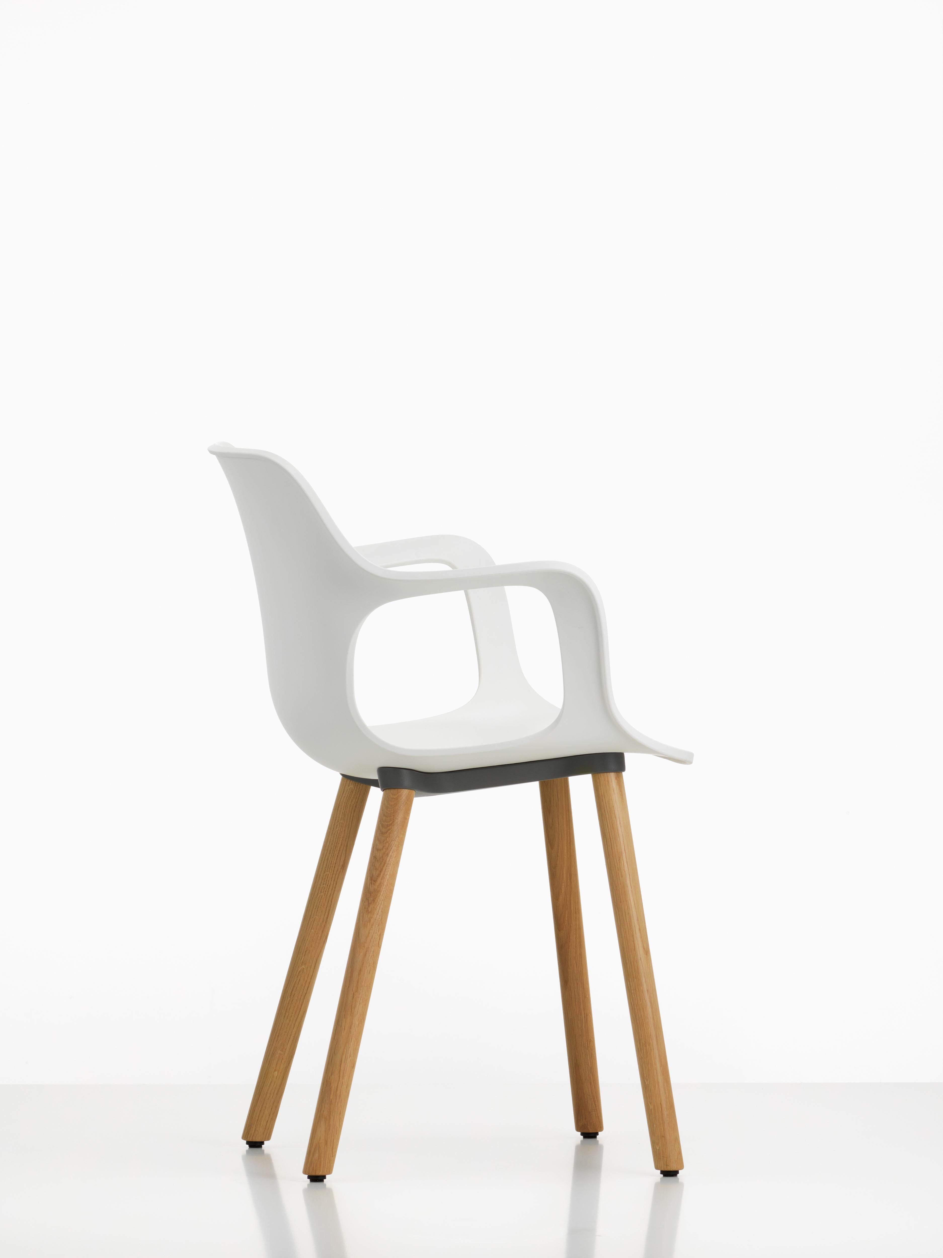 These products are only available in the United States.

HAL Armchair Wood by Jasper Morrison has a distinctive design, which combines a curved plastic shell with the contrasting linearity of a robust four-legged wooden base. The comfortable seat