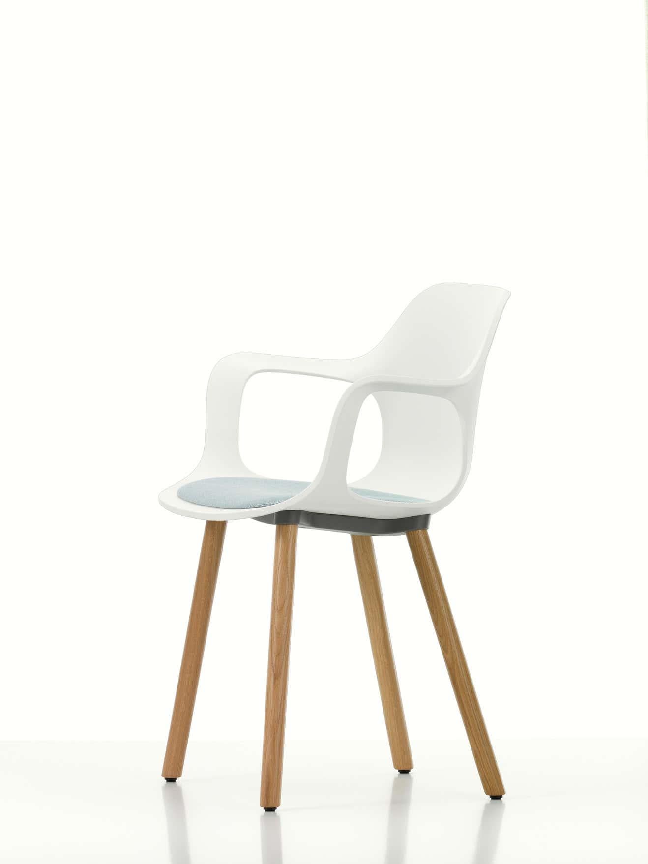 Vitra HAL armchair wood with seat upholstery in white by Jasper Morrison.

Materials:
Seat shell: Dyed-through polypropylene, with seat cushion (screwed to the seat shell).
Base: Non-stackable wooden base in natural oak Connecting element