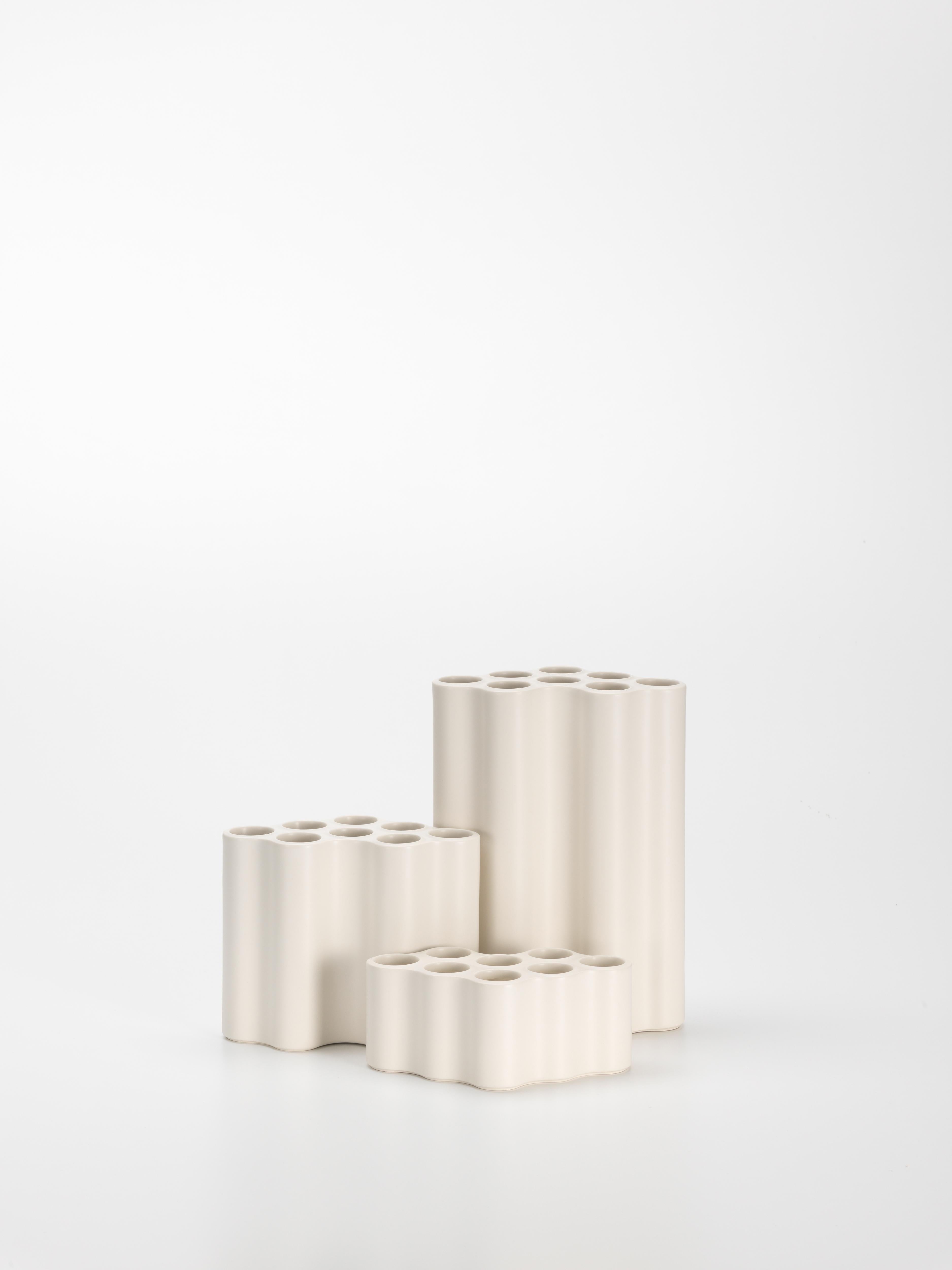 These products are only available in the United States.

The Nuage vases in ceramic are elaborately handcrafted, resulting in scarcely discernible differences that make each charming vase a unique object. The undulating surfaces produce an