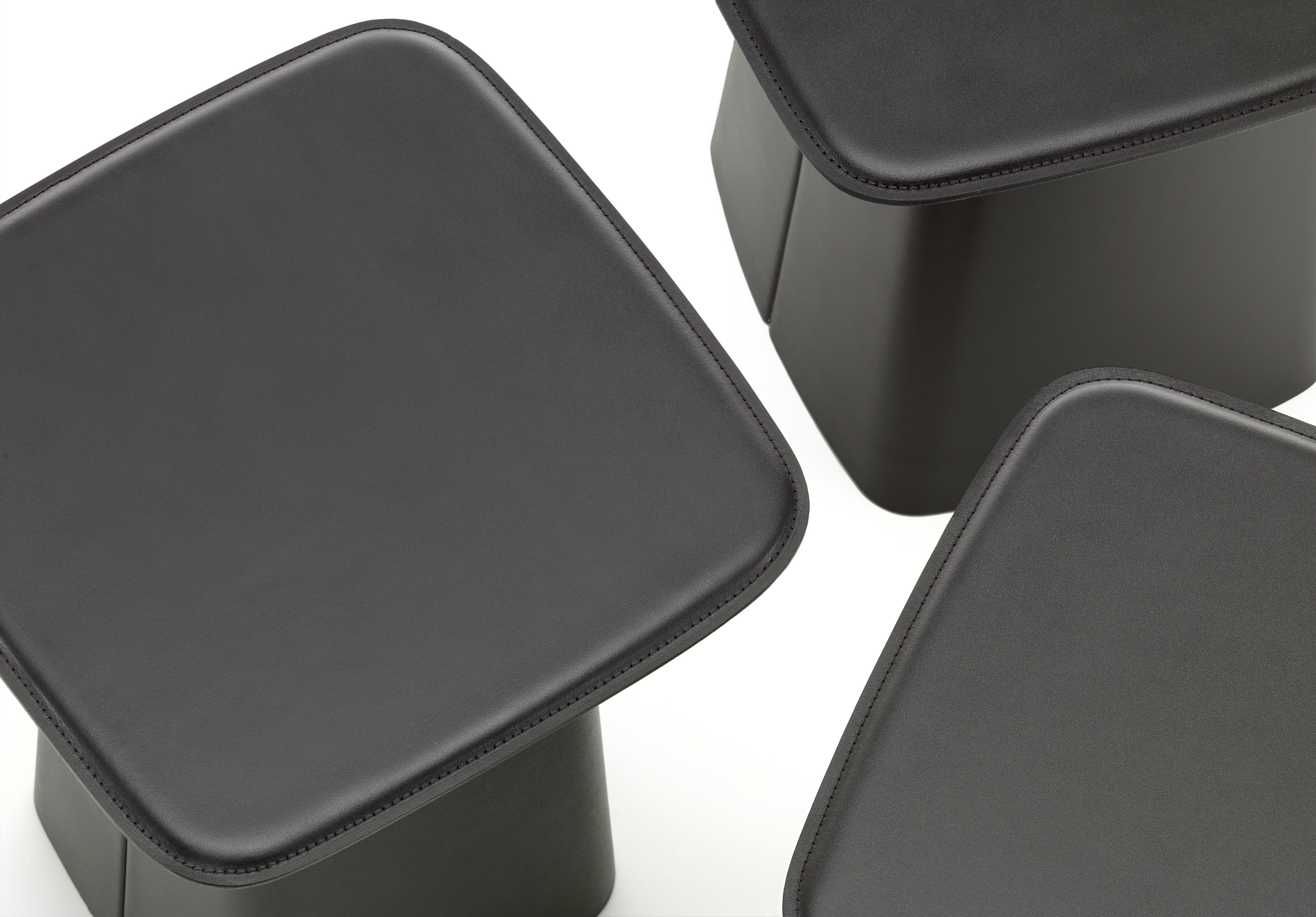 These products are only available in the United States.

Designed by Ronan and Erwan Bouroullec, the leather side tables are covered with a high-quality, robust split leather. Precisely crafted with decorative seams, the leather covers give these