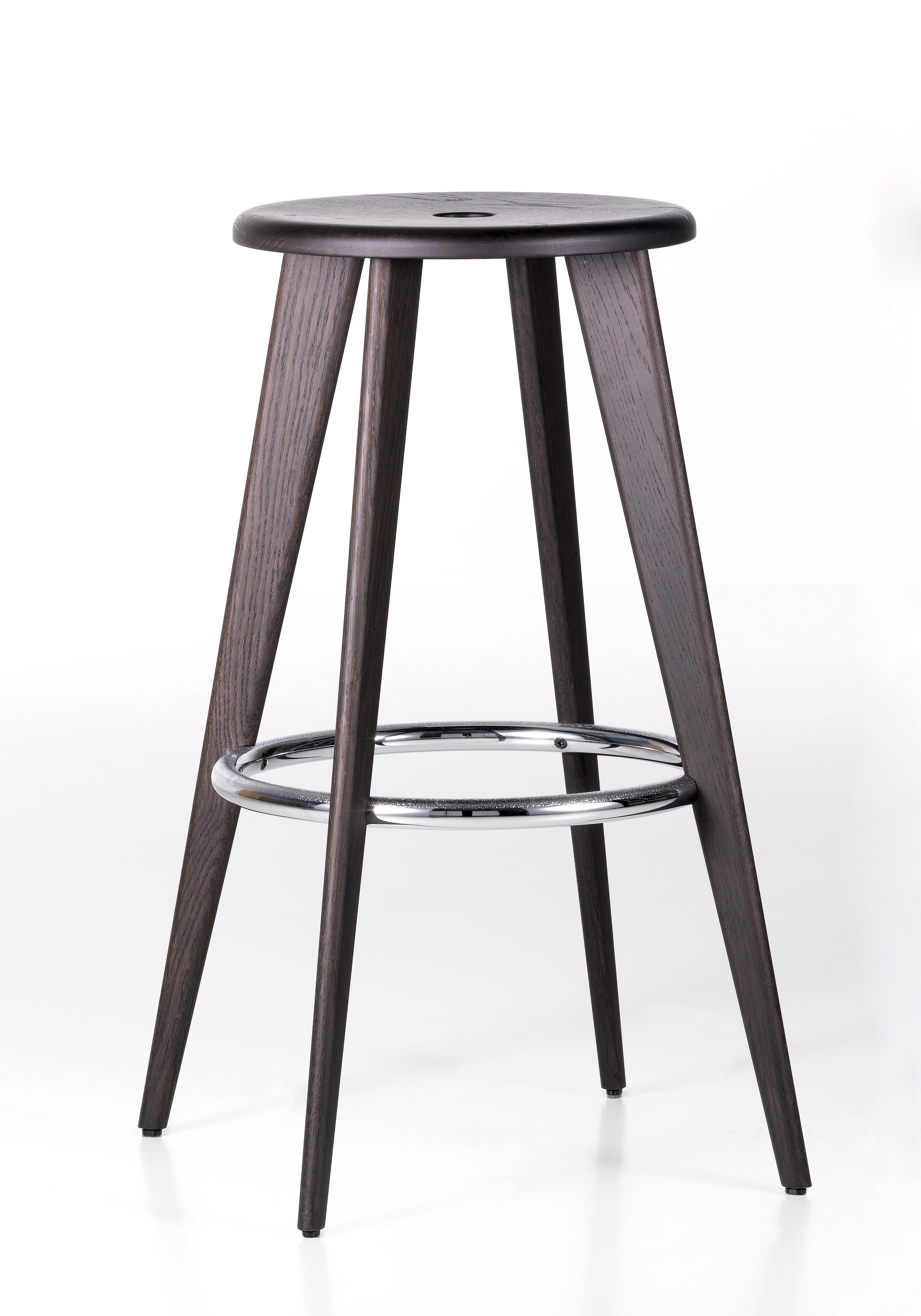 These items are currently only available in the United States.

For the design of Tabouret Haut, Jean Prouvé drew on a traditional type of bar stool that is still in common use today: a thin round seat resting on top of four long, canted legs. A