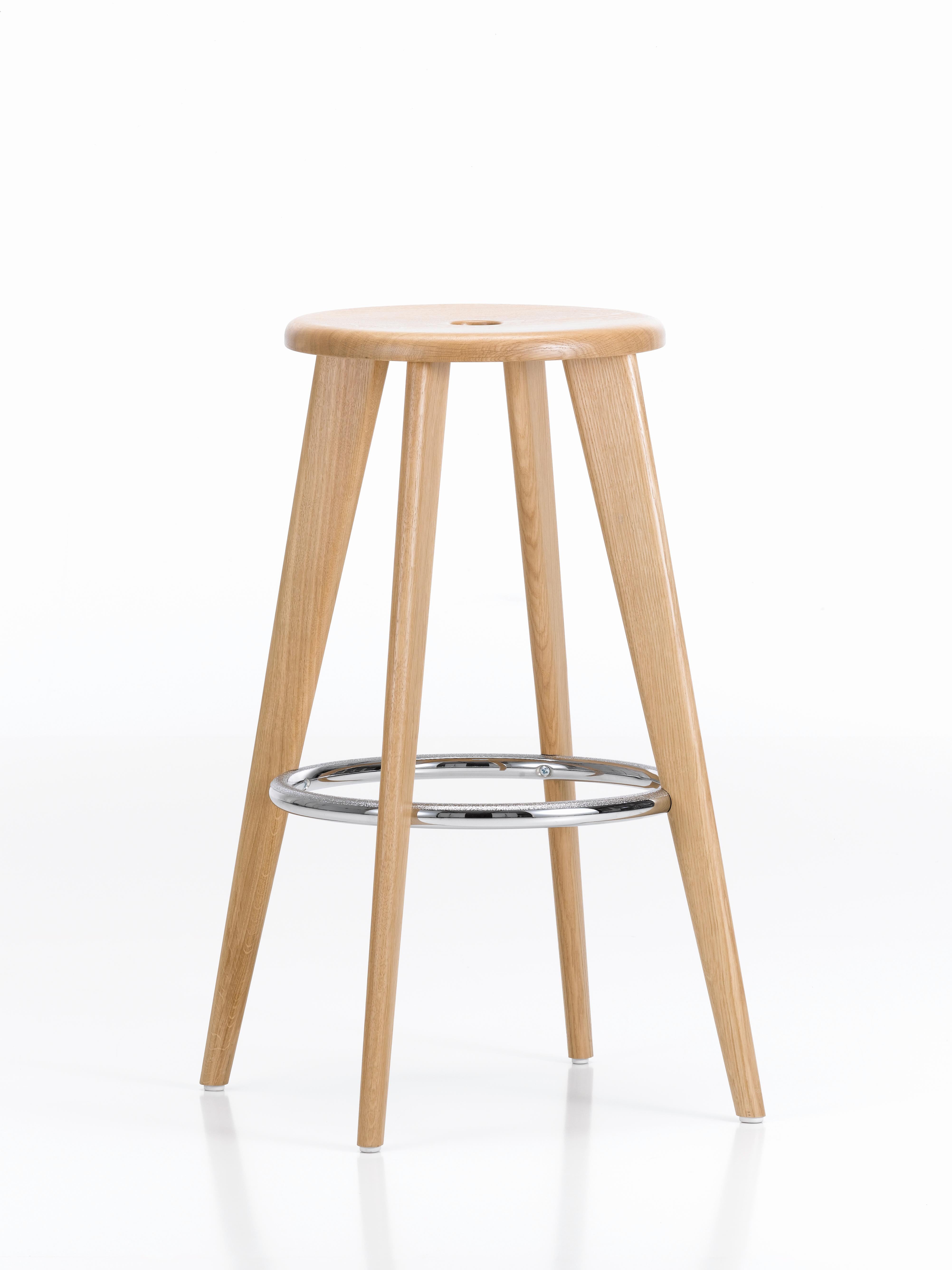 These items are currently only available in the United States.

For the design of Tabouret Haut, Jean Prouvé drew on a traditional type of bar stool that is still in common use today: a thin round seat resting on top of four long, canted legs. A