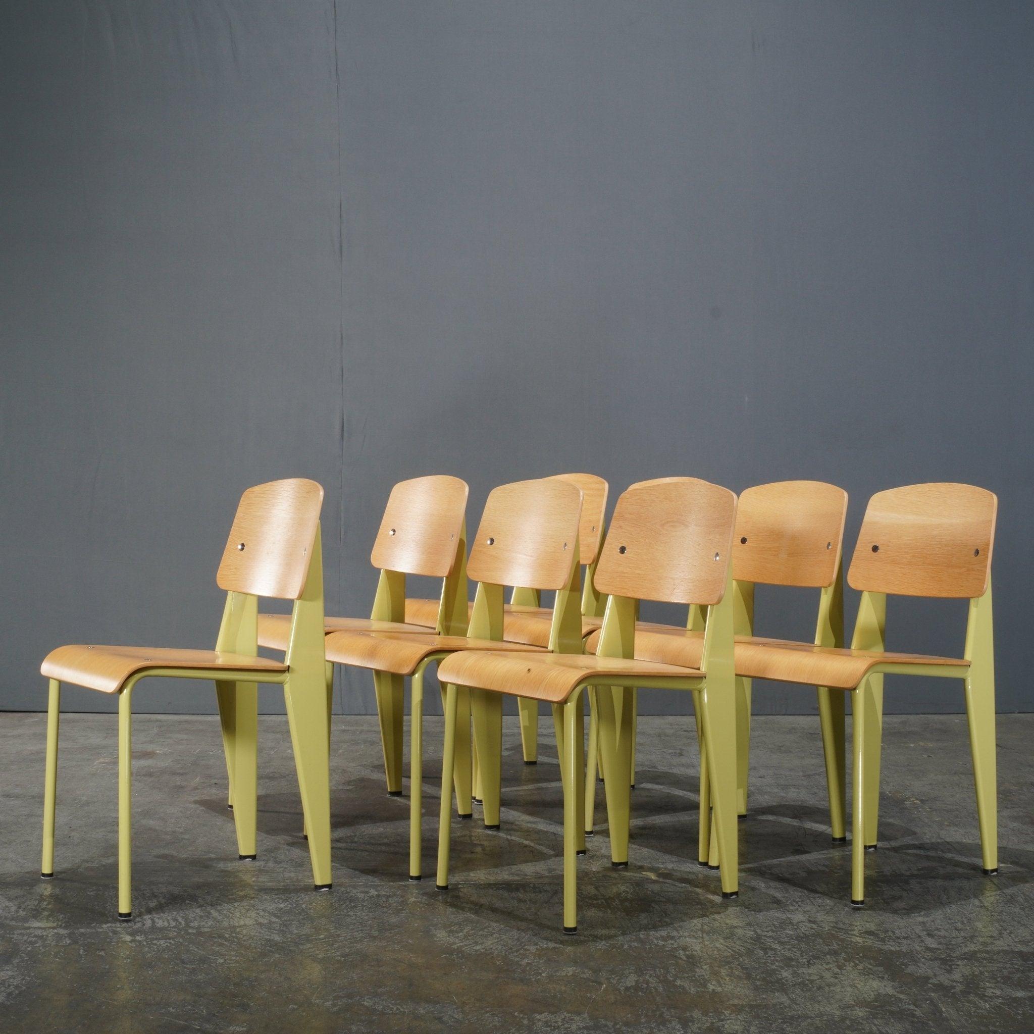 The Vitra Yellow Standard Chair by Jean Prouvé is an iconic piece that effortlessly blends industrial design with timeless elegance. Its sturdy steel frame supports the chair's minimalistic yet functional form, while the bold yellow seat and