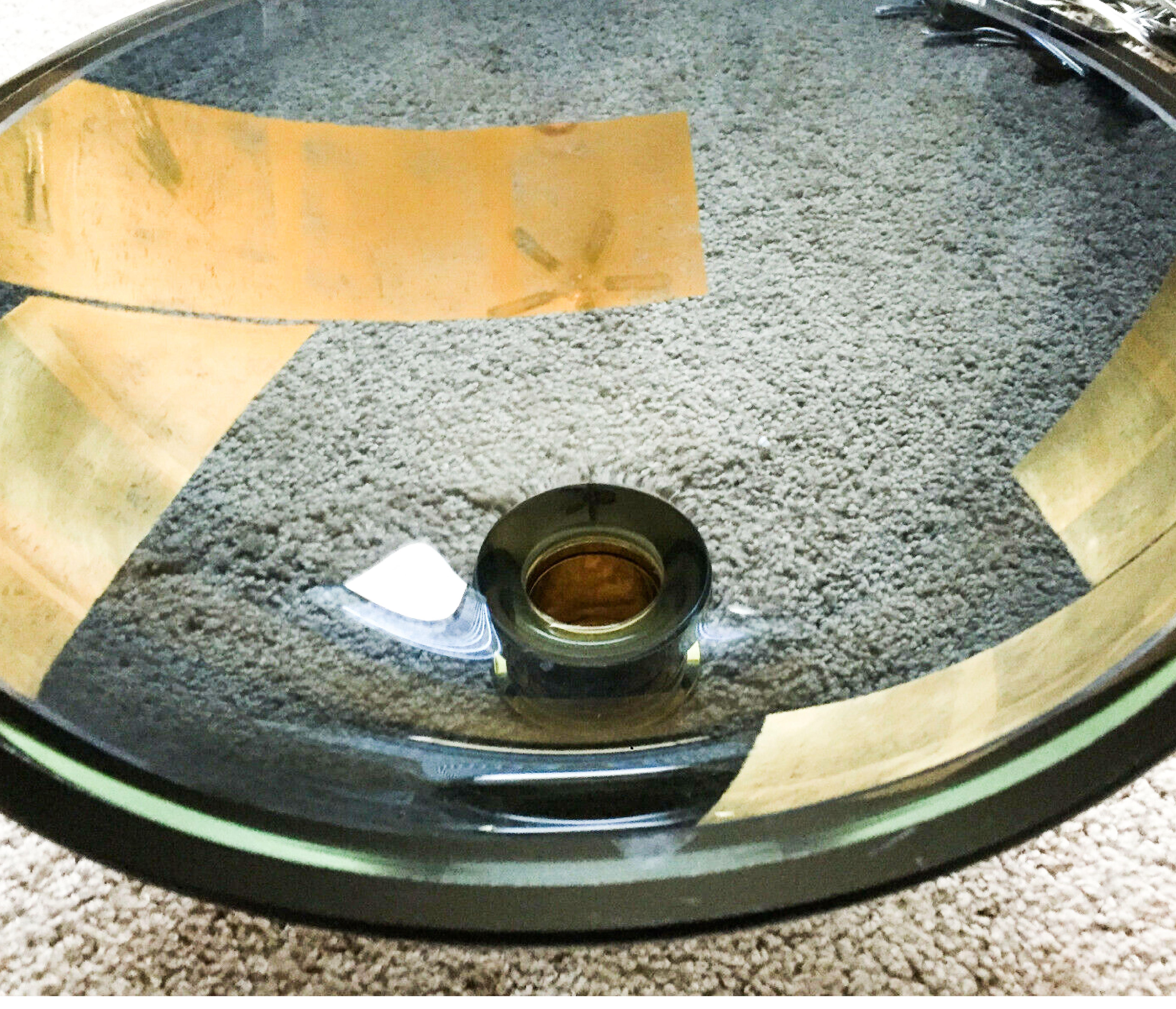 Vitraform large round art glass gilded fragment freestanding vessel sink, black. MSRP 3800 USD. 

Vitraform was founded by Jerry and Sheila Fein in the 1980s. While remodeling their bathroom, Jerry was struck by the extremely limited variety of