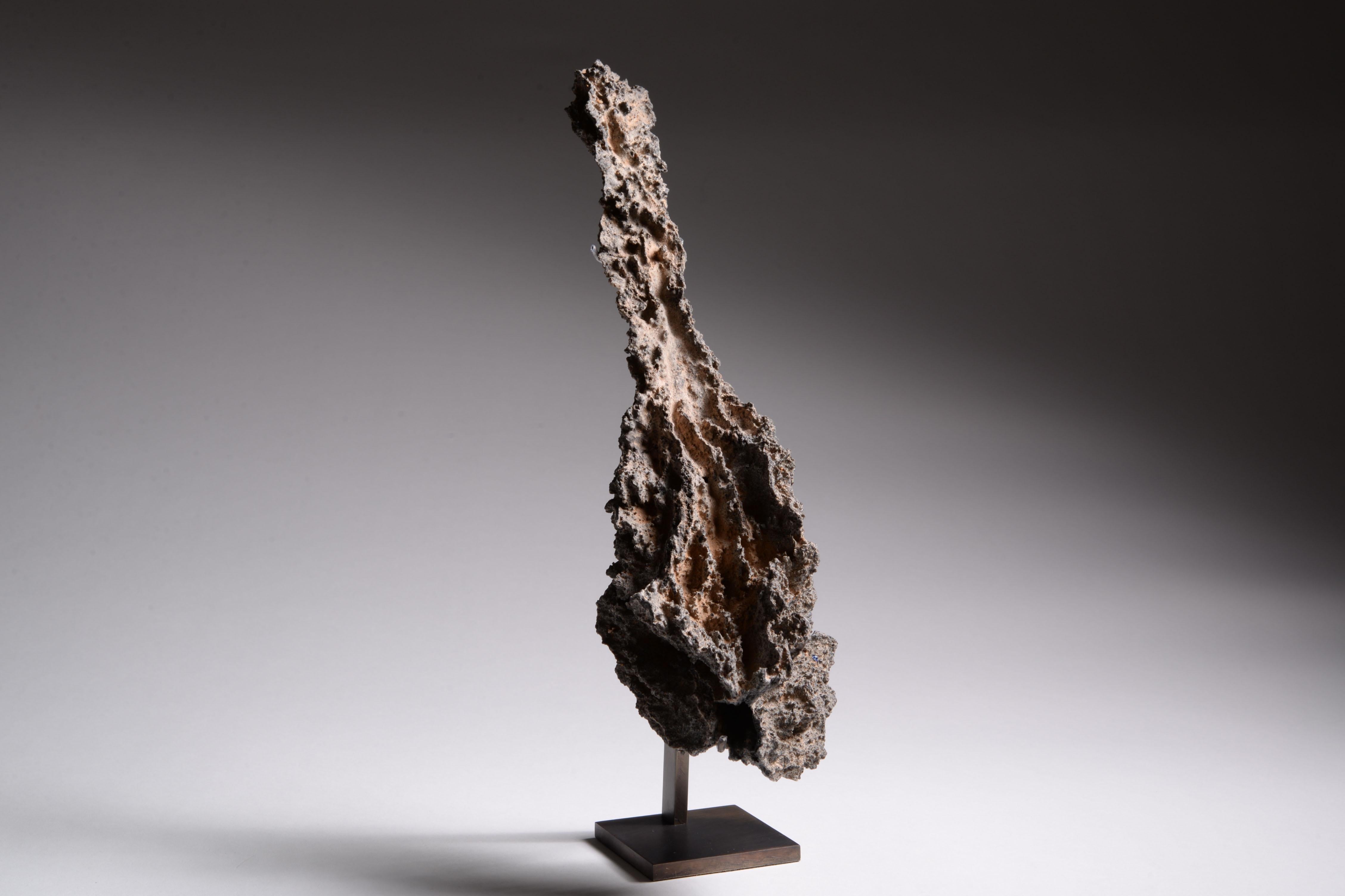 An Extraordinarily well preserved specimen of Fulgurite
Tubular Lechatetierite
Formation date unknown, recovered from the Sahara Desert, Algeria, circa 2006

This remarkable natural sculpture was formed in one ten thousandth of a second, from