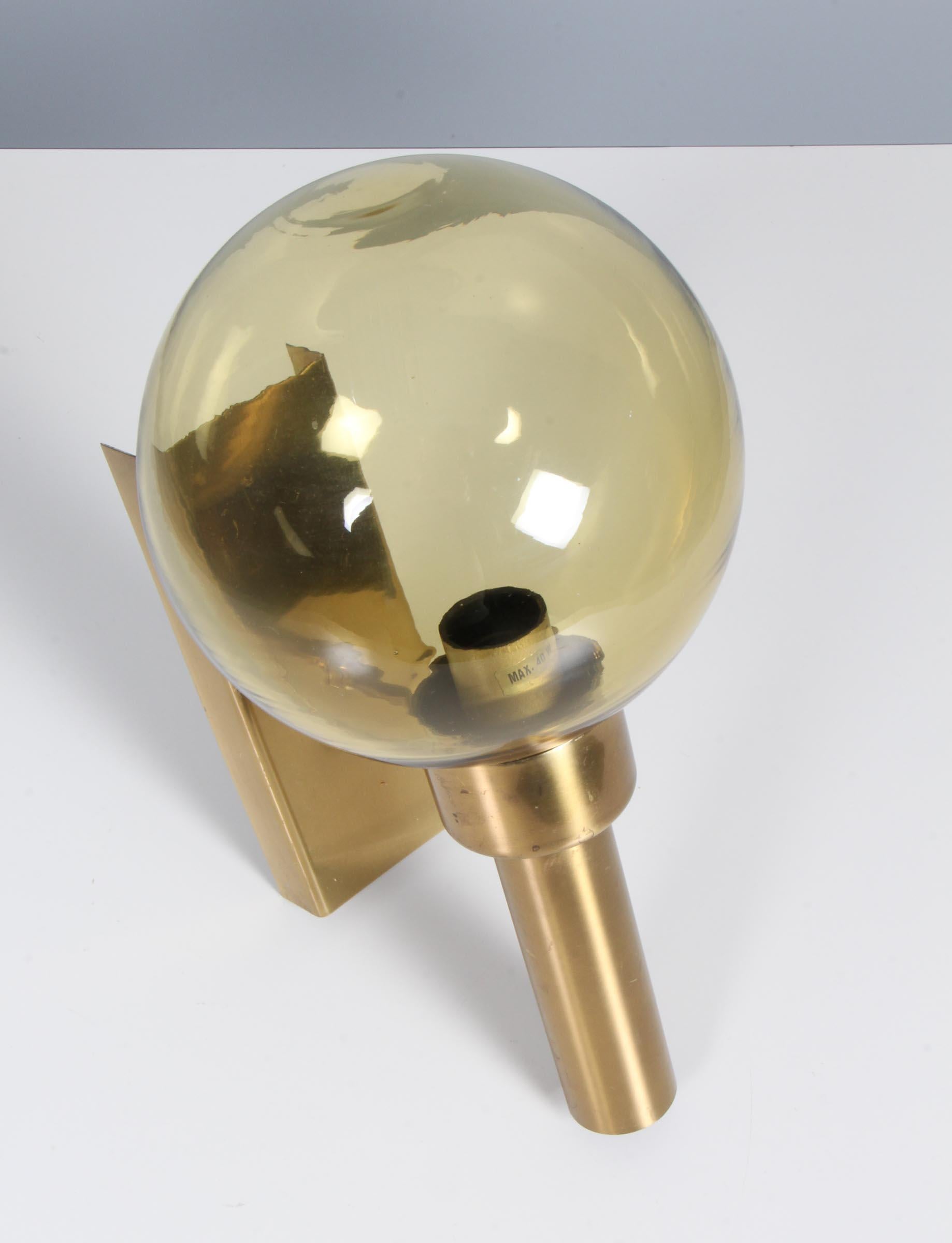 Vitrika wall lamp in glass and brass.

Made by Vitrika.