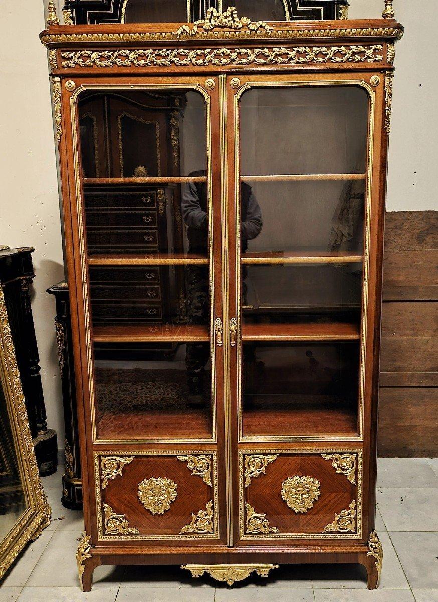 Beautiful French Showcase Or bookcase with Two Doors in Napoleon III and Boulle style.
Two-door display case in fruit wood veneer and curling, significant ornamentation of gilded bronzes with scraps, multiple ingot molds, foliage gallery, side