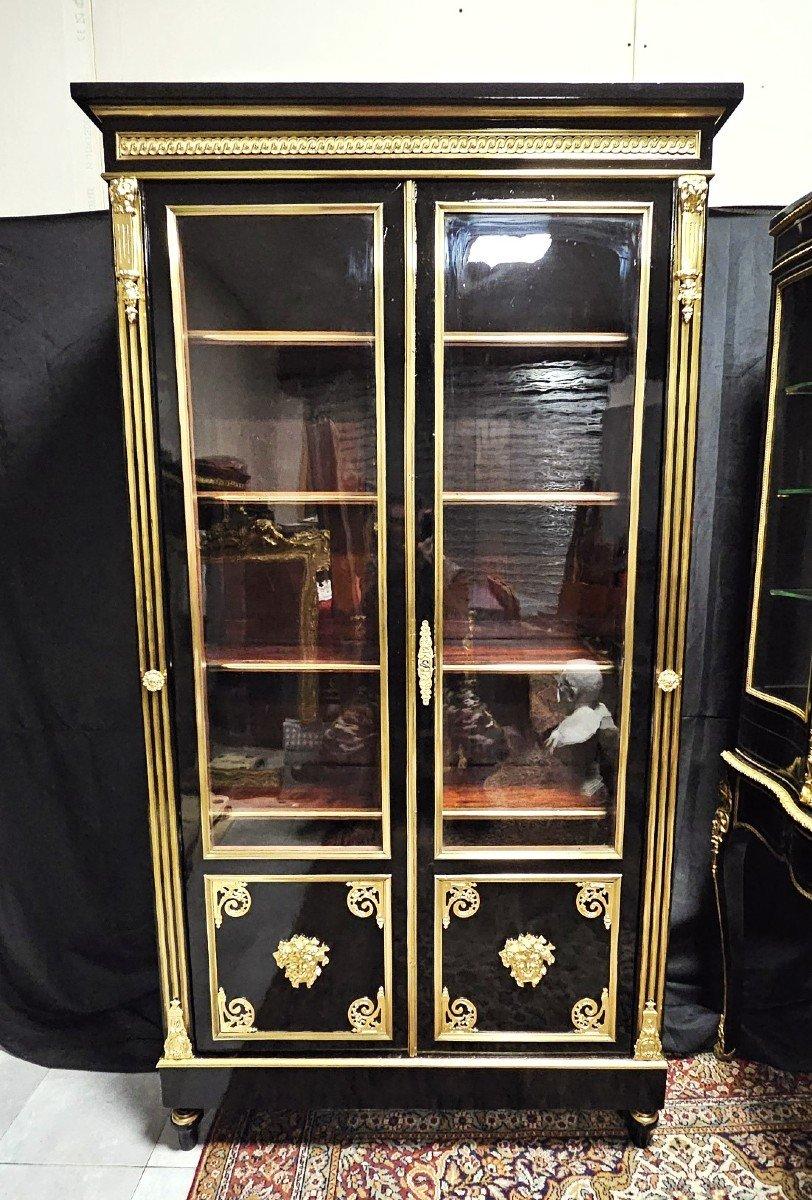 Very elegant Large Boulle Showcase Or Library 2 Doors Napoleon III Period bookcase or display case with marquetry of brass nets, and including beautiful ornamentation of gilded bronzes with ingot molds, spandrels, masks on the doors, upper and lower