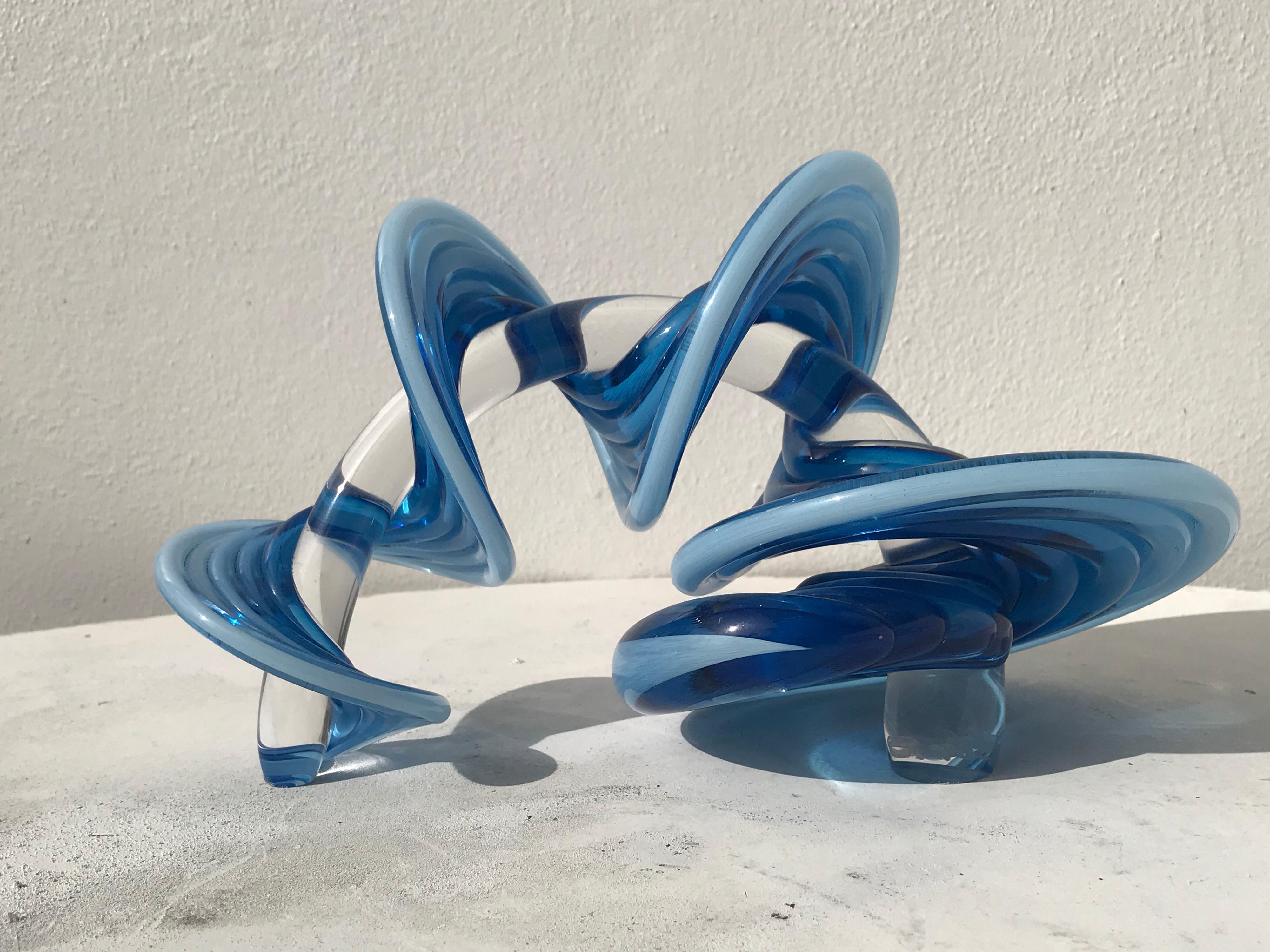 Blue to clear glass abstract sculpture. .
By Thomas Kelly.
 