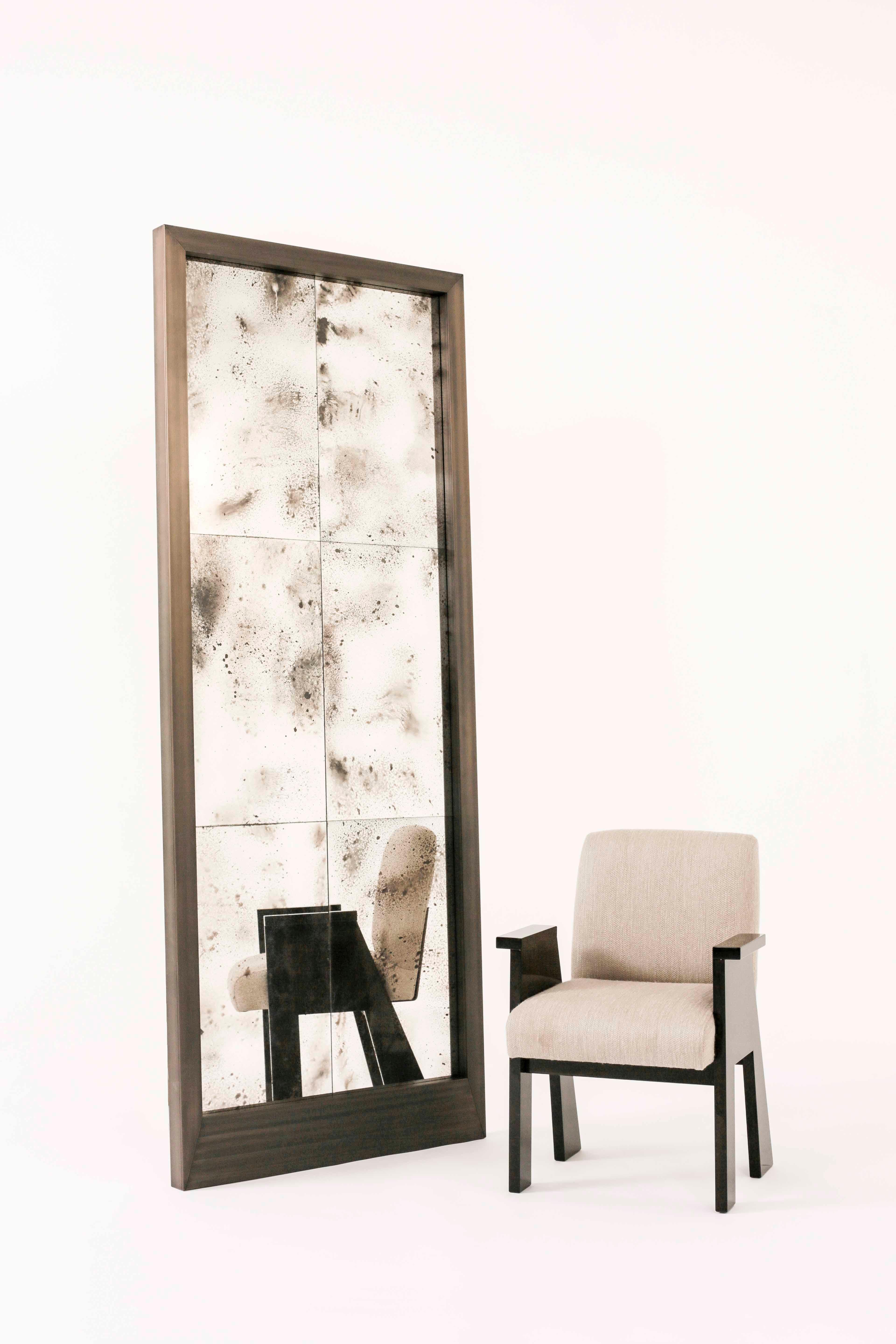 Tapping into a modern mood, the Virtum mirror works a solid brass frame with a clean-lined silhouette. Inspired by the Latin meaning of glass the designs mirrored panels are distinguished by an antique effect – perfect for adding an aged allure to