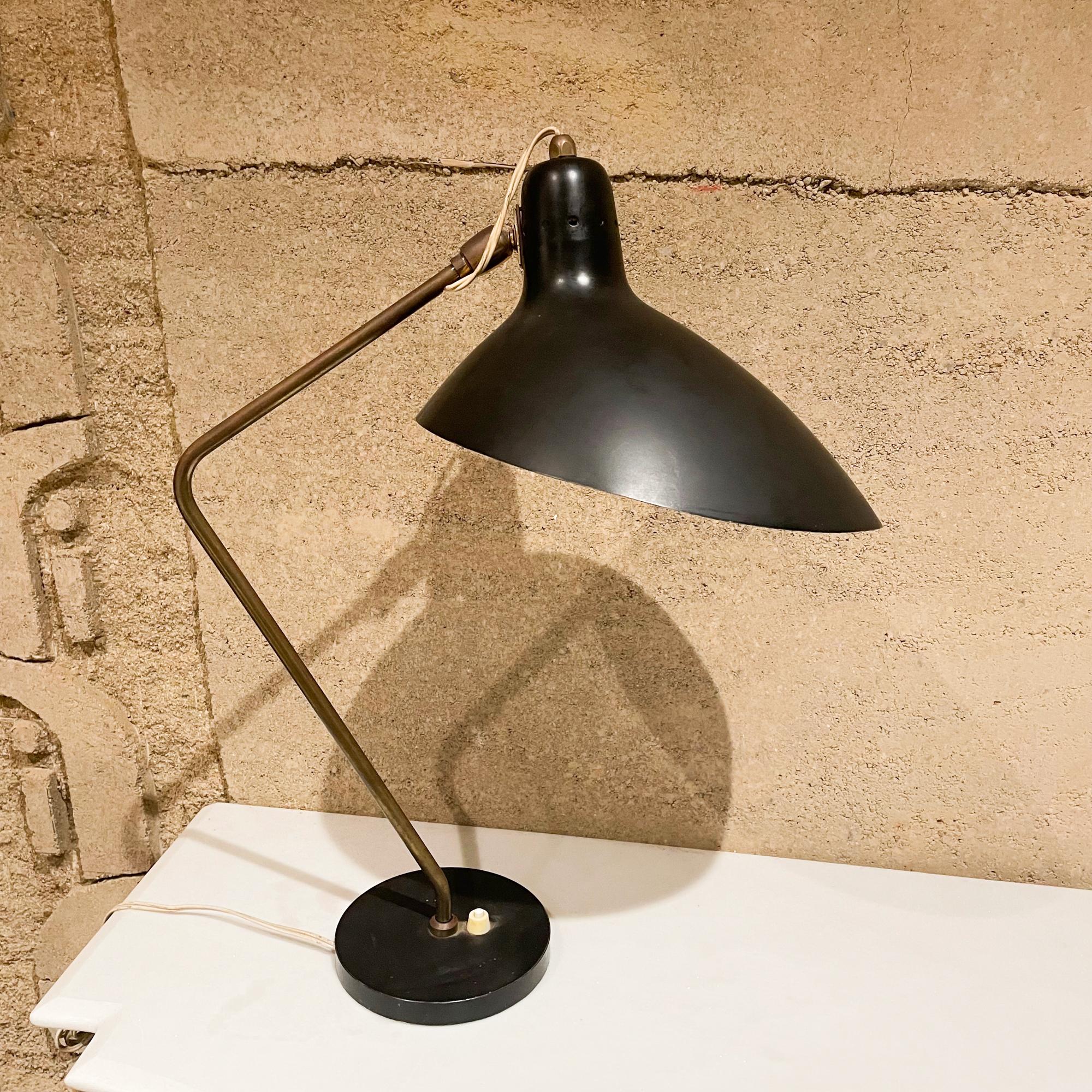 Table lamp
Fabulous midcentury French table desk lamp in black. Unmarked. Design attributed to Vittoriano Vigano and in the style of Serge Mouille.
The lamp is vintage, made in France circa 1950s. Retains original bayonet socket. Bayonet bulbs are
