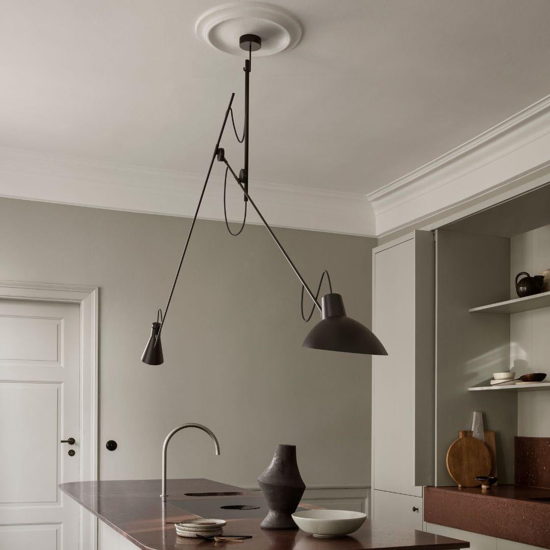 Vittoriano Viganò 'VV Cinquanta' suspension lamp in black for Astep. 

Viganò was the art director of Arteluce, the company founded by his creative partner Gino Sarfatti, and the visor was one of his most celebrated design series. Designed in 1951