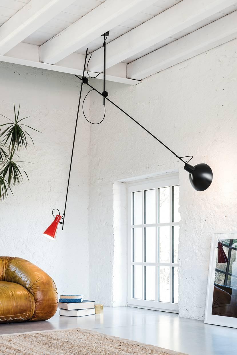 Vittoriano Viganò 'VV Suspension' lamp in red and black for Astep. 

Viganò was the art director of Arteluce, the company founded by his creative partner Gino Sarfatti, and the visor was one of his most celebrated design series. Designed in 1951