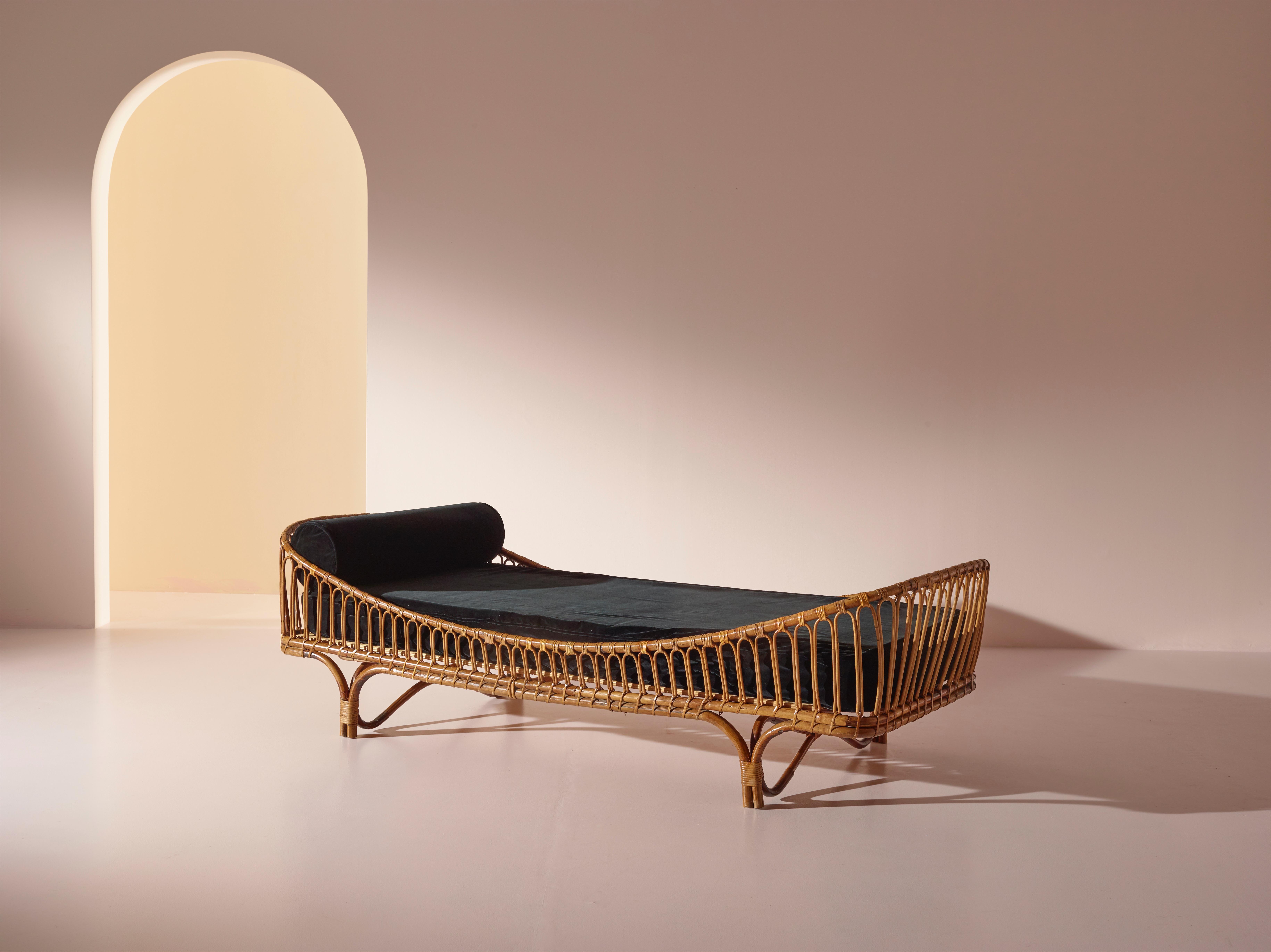 This bamboo and rattan daybed designed by Mario Cristiani in the early 1960s is a beautiful and rare piece of furniture that exudes a sense of exoticism and glamour. Its unique design is characterized by the use of natural materials and a