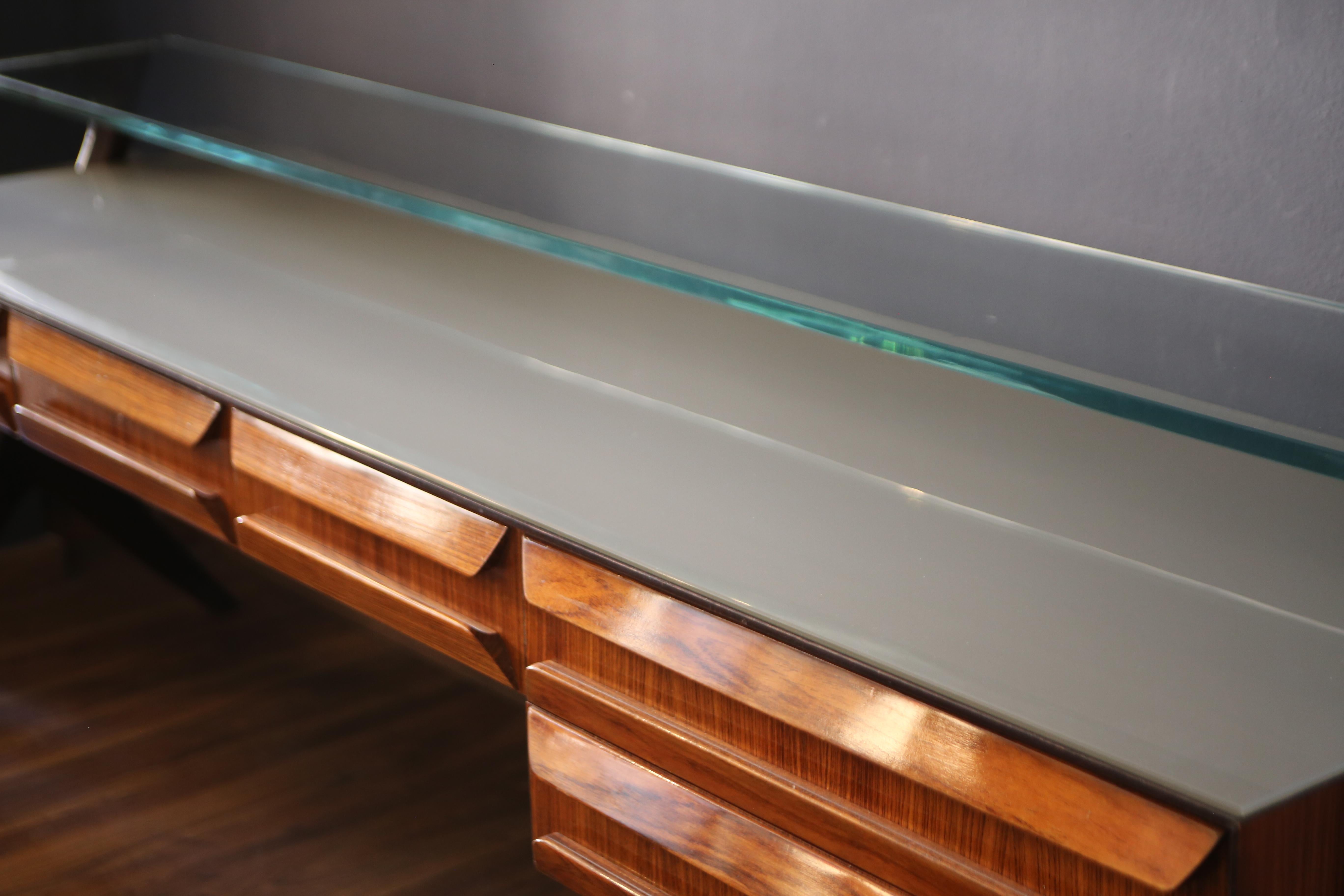 Wall cupboard with ebonized wooden supports, wooden body and carved glass top. of the highest quality