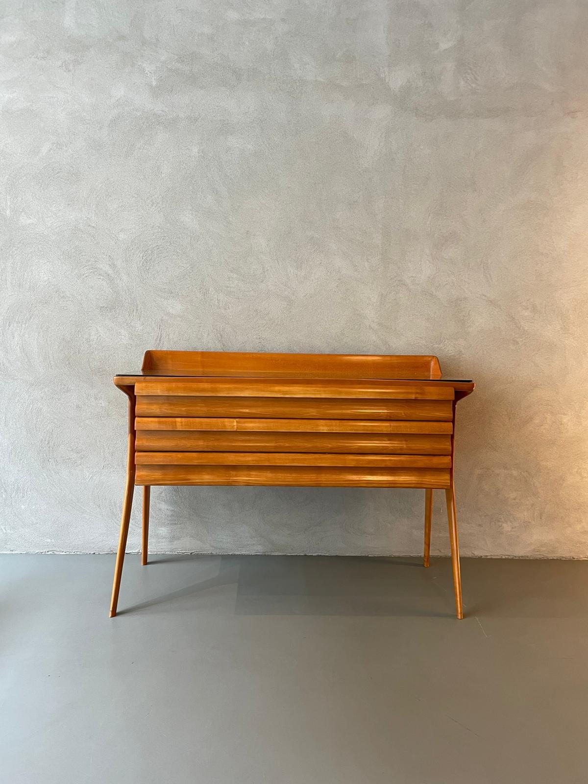 Cupboard designed by Vittorio Dassi and manufactured in Italy, 1950s.
Chest of drawers in ash with the typical shape of Vittorio dassi's drawings, with a sinuous base, composed of two feet on each side.
There are three drawers above which there is