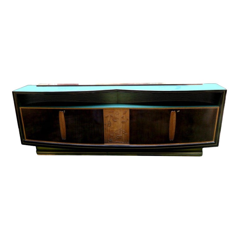 Vittorio DASSI long credenza, buffet, sideboard with 5 doors made in the 1960s.
Sycamore and walnut with beveled green glass tops.
In good original condition Brass ornaments on the doors and key included. 